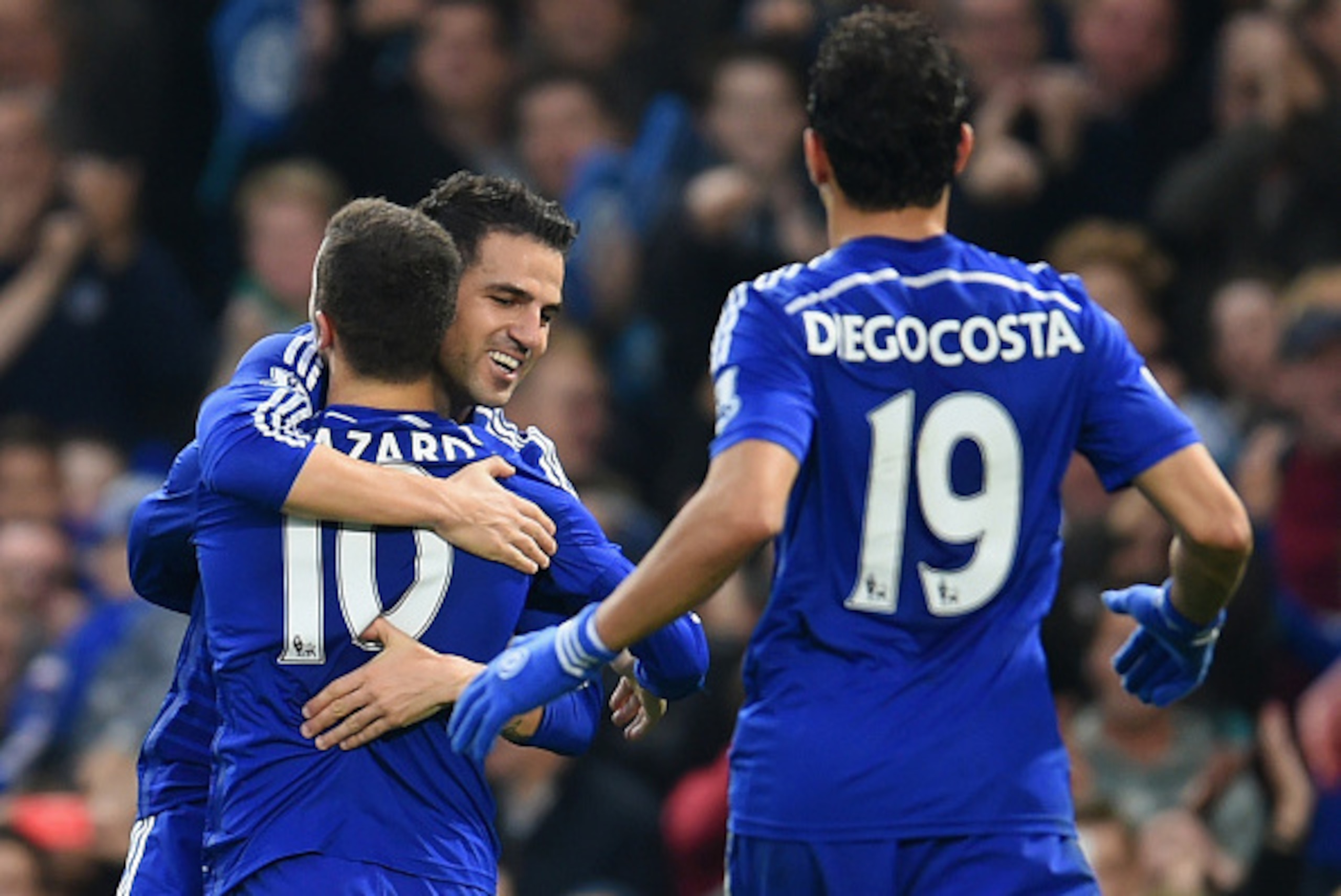 LONDON, ENGLAND - NOVEMBER 22:  Cesc Fabregas of Chelsea hugs Eden Hazard of Chelsea after he scored their second goal during the Barclays Premier League match between Chelsea and West Bromwich Albion at Stamford Bridge on November 22, 2014 in London, Eng