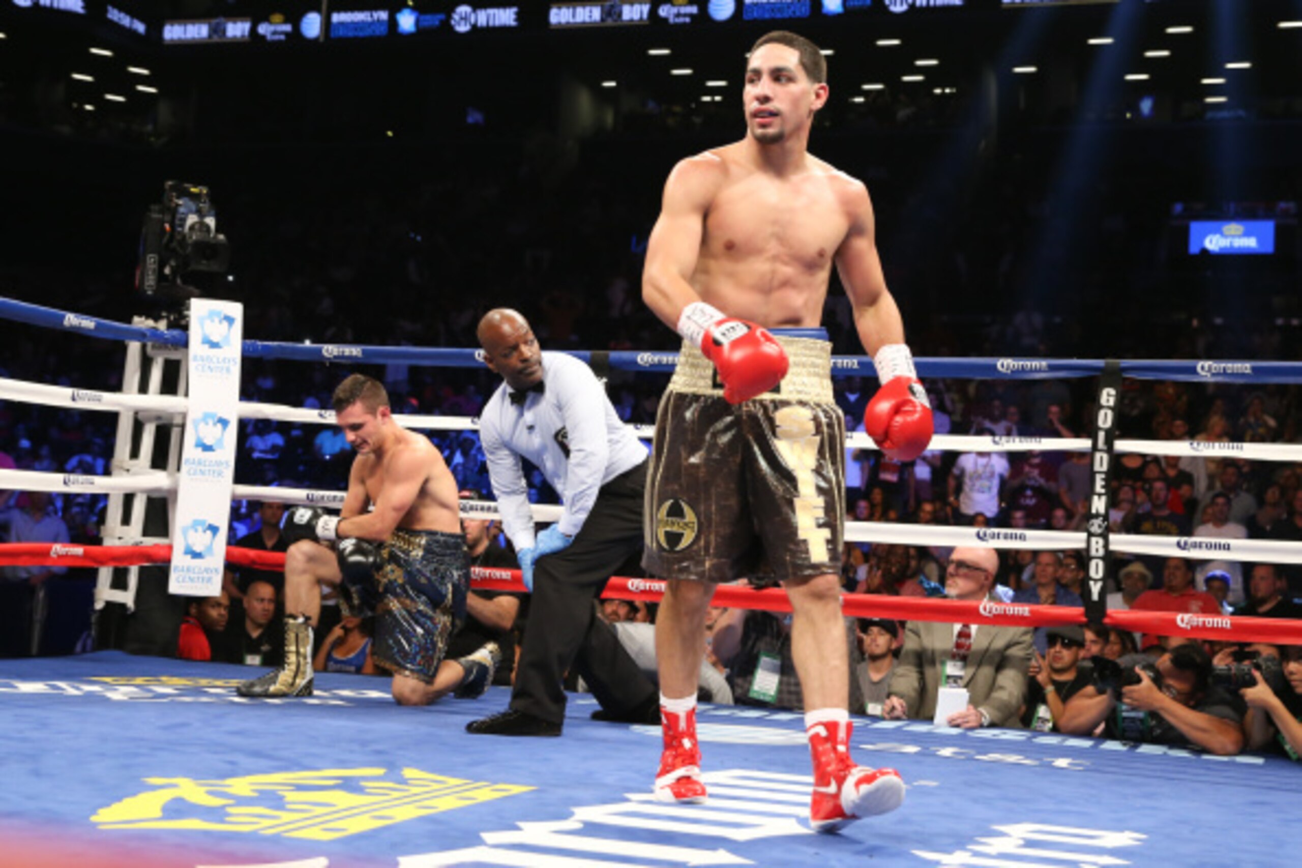BROOKLYN, NY - AUGUST 9: Danny Garcia (Brown/Gold trunks) knocks down Rod Salka (Black/Gold trunks) during their fight at the Barclays Center on August 9, 2014 in Brooklyn, New York. (Photo by Ed Mulholland/Getty Images)