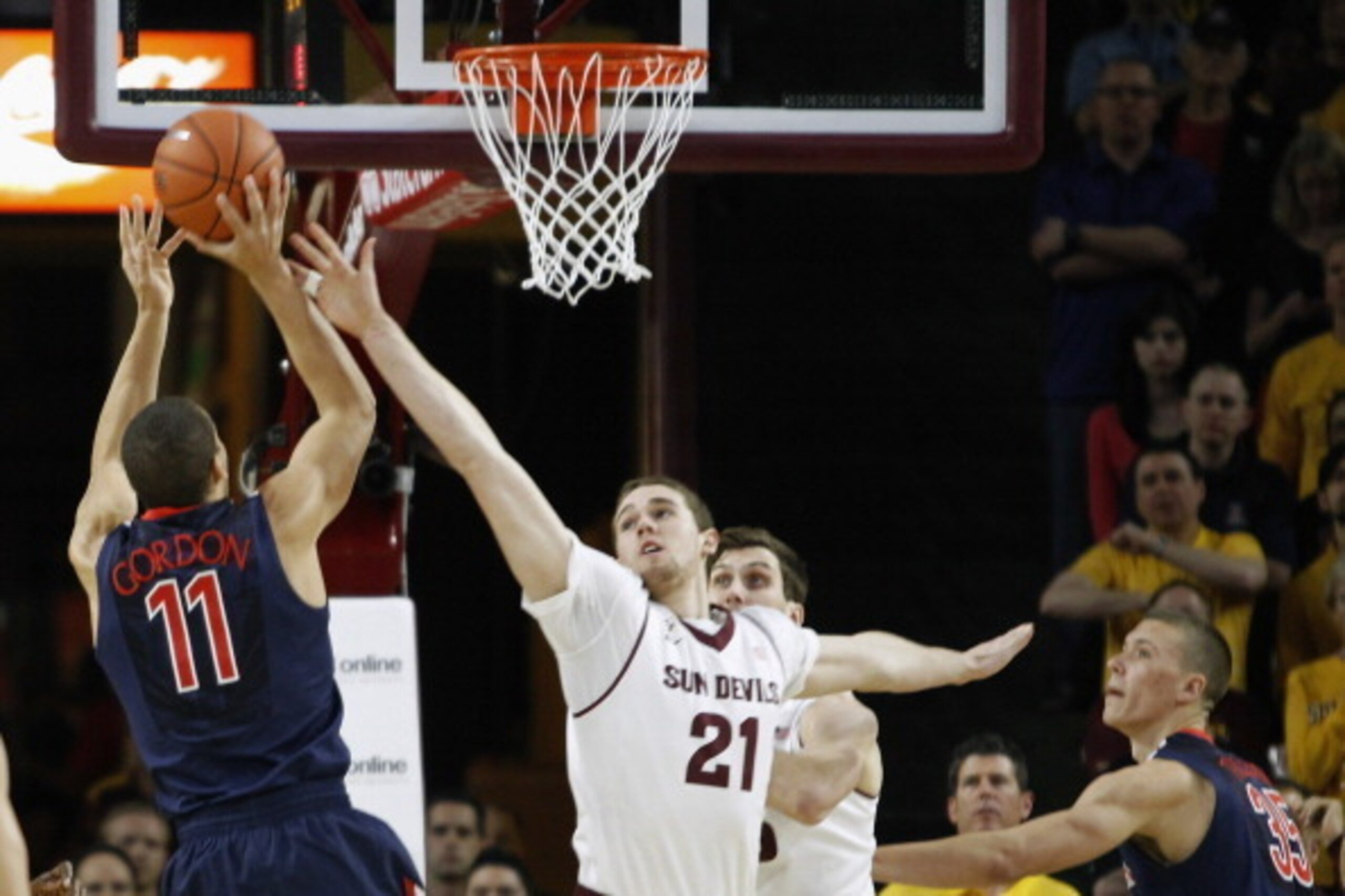 TEMPE, AZ - FEBRUARY 14:  Eric Jacobsen #21 of the Arizona State Sun Devils defends the shot of Aaron Gordon #11 of the Arizona Wildcats during the first half of a college basketball game at Wells Fargo Arena on February 14, 2014 in Tempe, Arizona.  (Phot
