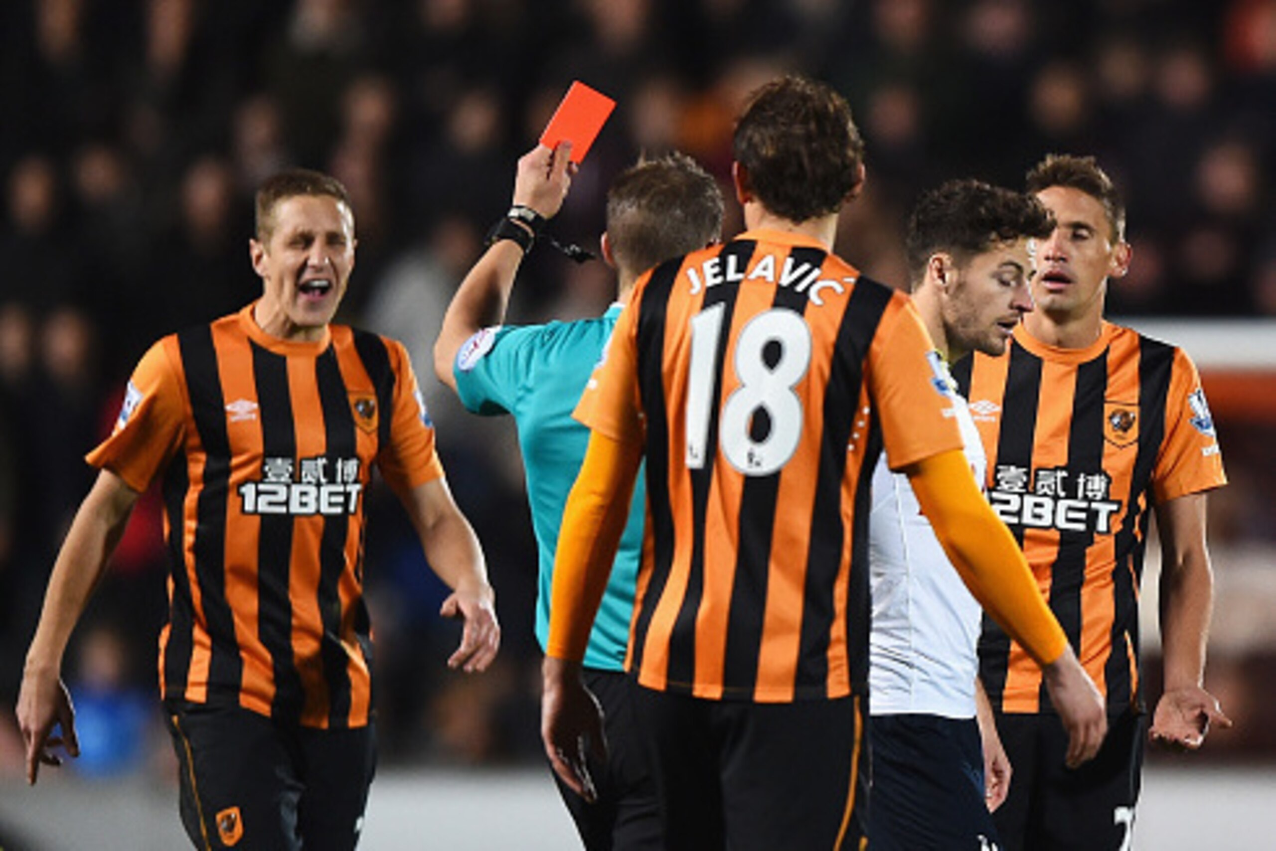 HULL, ENGLAND - NOVEMBER 23:  Gaston Ramirez of Hull City is shown the red card by referee Craig Pawson during the Barclays Premier League match between Hull City and Tottenham Hotspur at KC Stadium on November 23, 2014 in Hull, England.  (Photo by Lauren