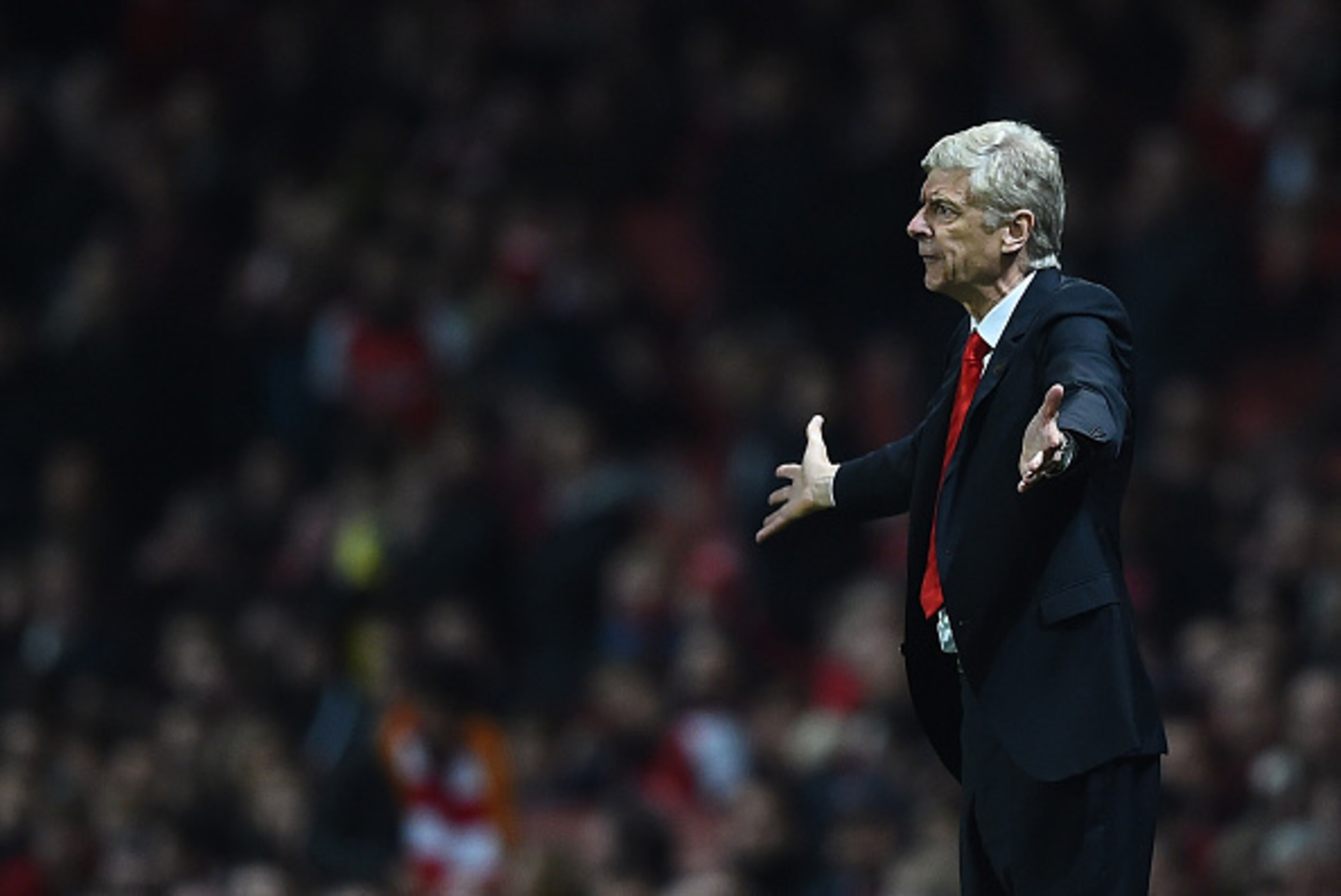 LONDON, ENGLAND - NOVEMBER 22:  Arsene Wenger, Manager of Arsenal gestures on the touchline during the Barclays Premier League match between Arsenal and Manchester United at Emirates Stadium on November 22, 2014 in London, England.  (Photo by Shaun Botter