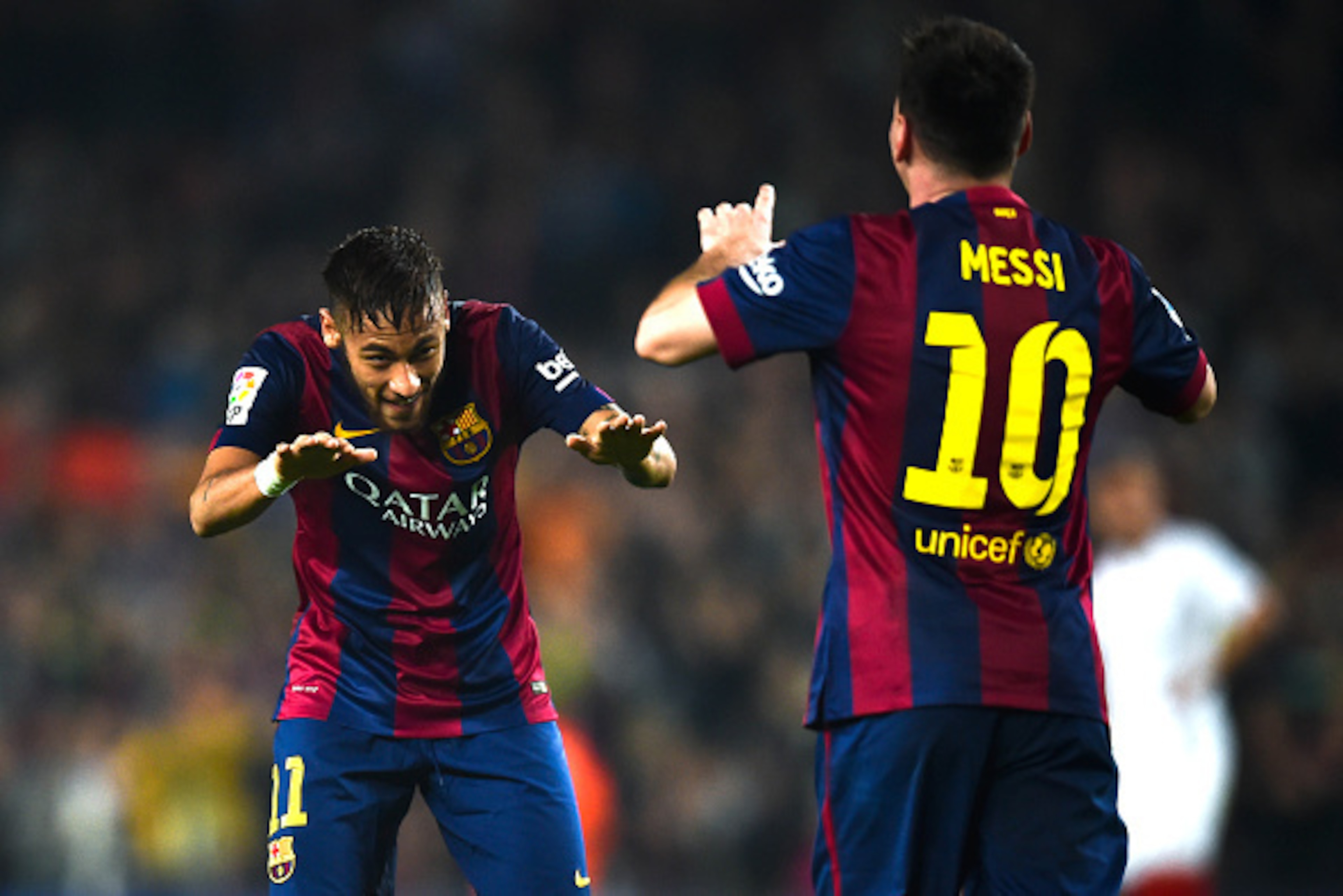 BARCELONA, SPAIN - NOVEMBER 22: Neymar of FC Barcelona acknowledges to  Lionel Messi of FC Barcelona after Messi scored his team's fourth goal during the La Liga match between FC Barcelona and Sevilla FC at Camp Nou on November 22, 2014 in Barcelona, Spai