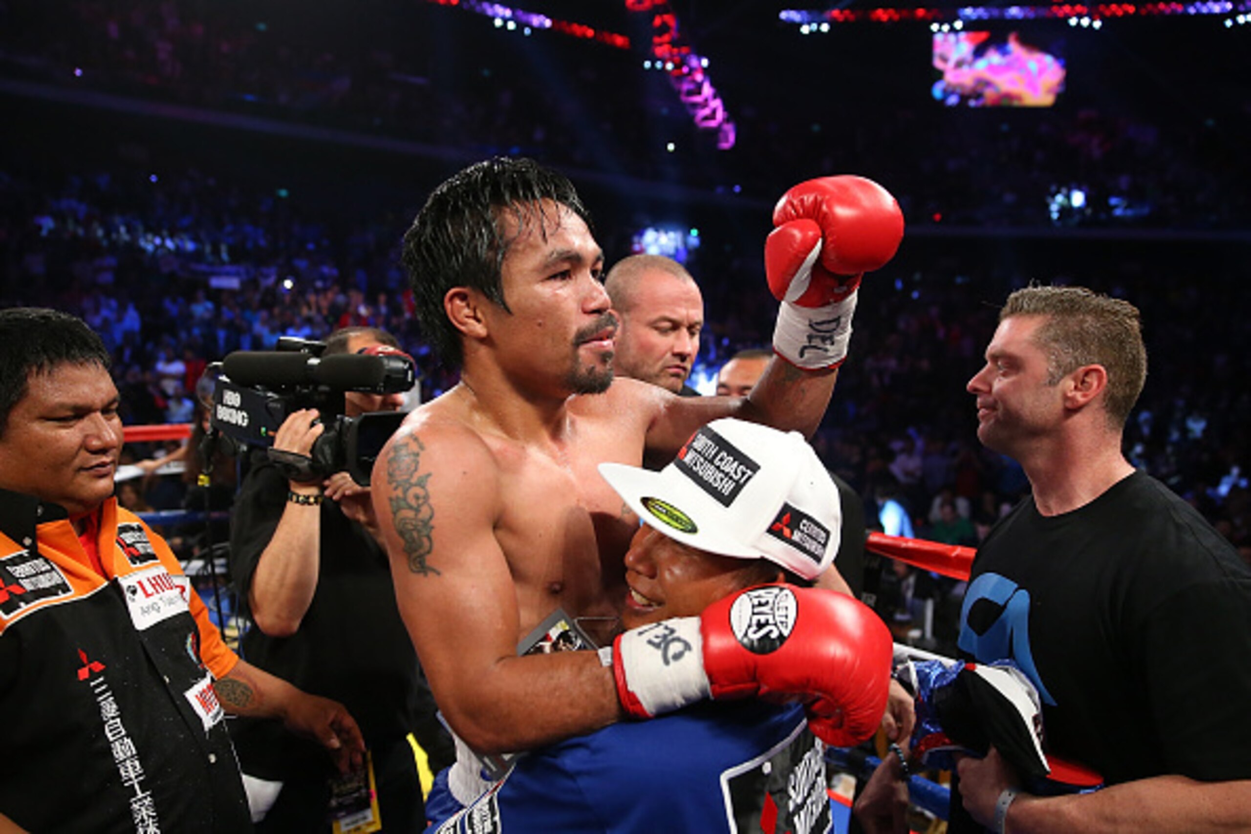 MACAU - NOVEMBER 23:  Manny Pacquiao of the Philippines celebrates winning against Chris Algieri of the United States during the WBO world welterweight title at The Venetian on November 23, 2014 in Macau, Macau.  (Photo by Chris Hyde/Getty Images)