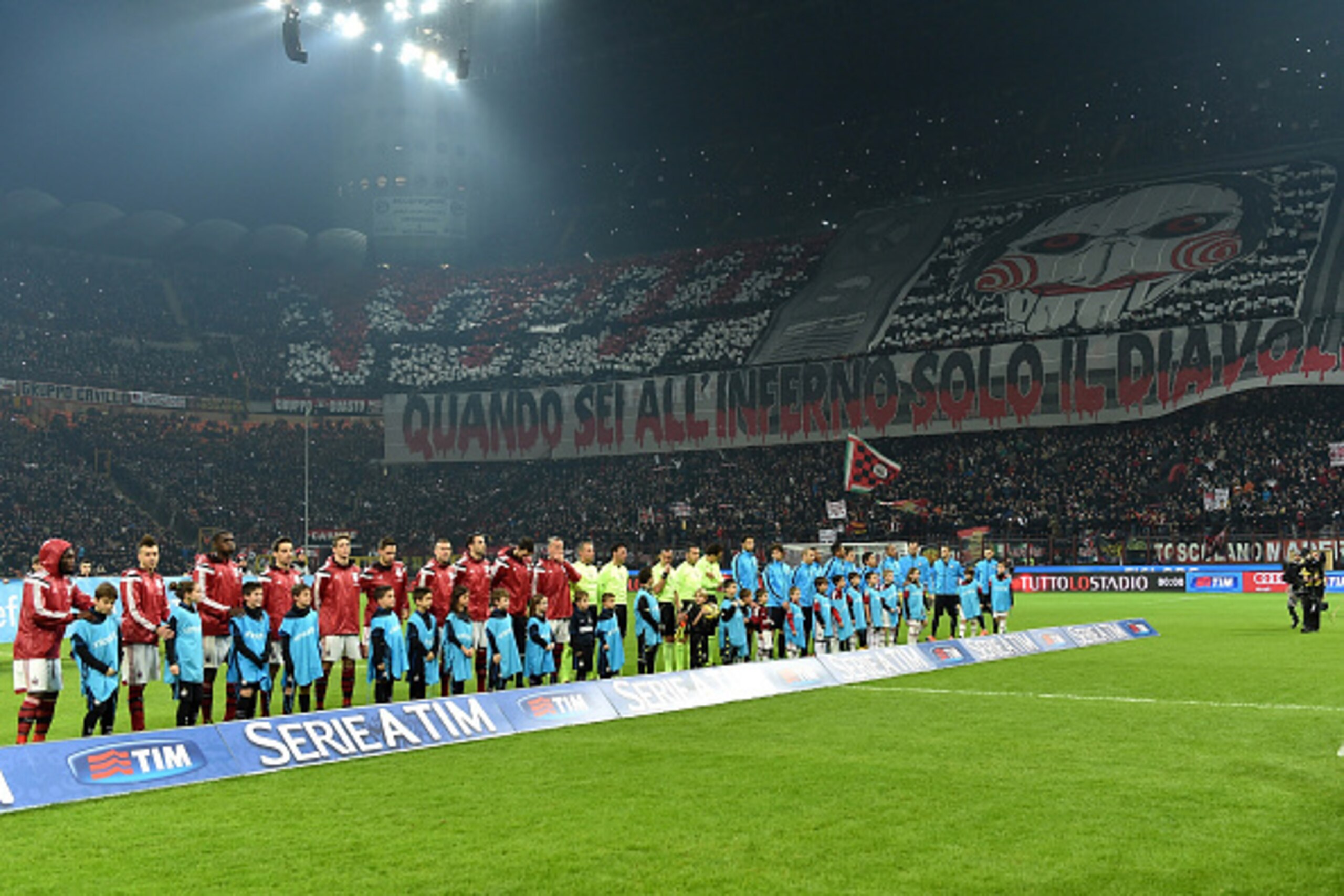MILAN, ITALY - NOVEMBER 23:  AC Milan fans display a giant banner during the Serie A match between AC Milan and FC Internazionale Milano at Stadio Giuseppe Meazza on November 23, 2014 in Milan, Italy.  (Photo by Valerio Pennicino/Getty Images)