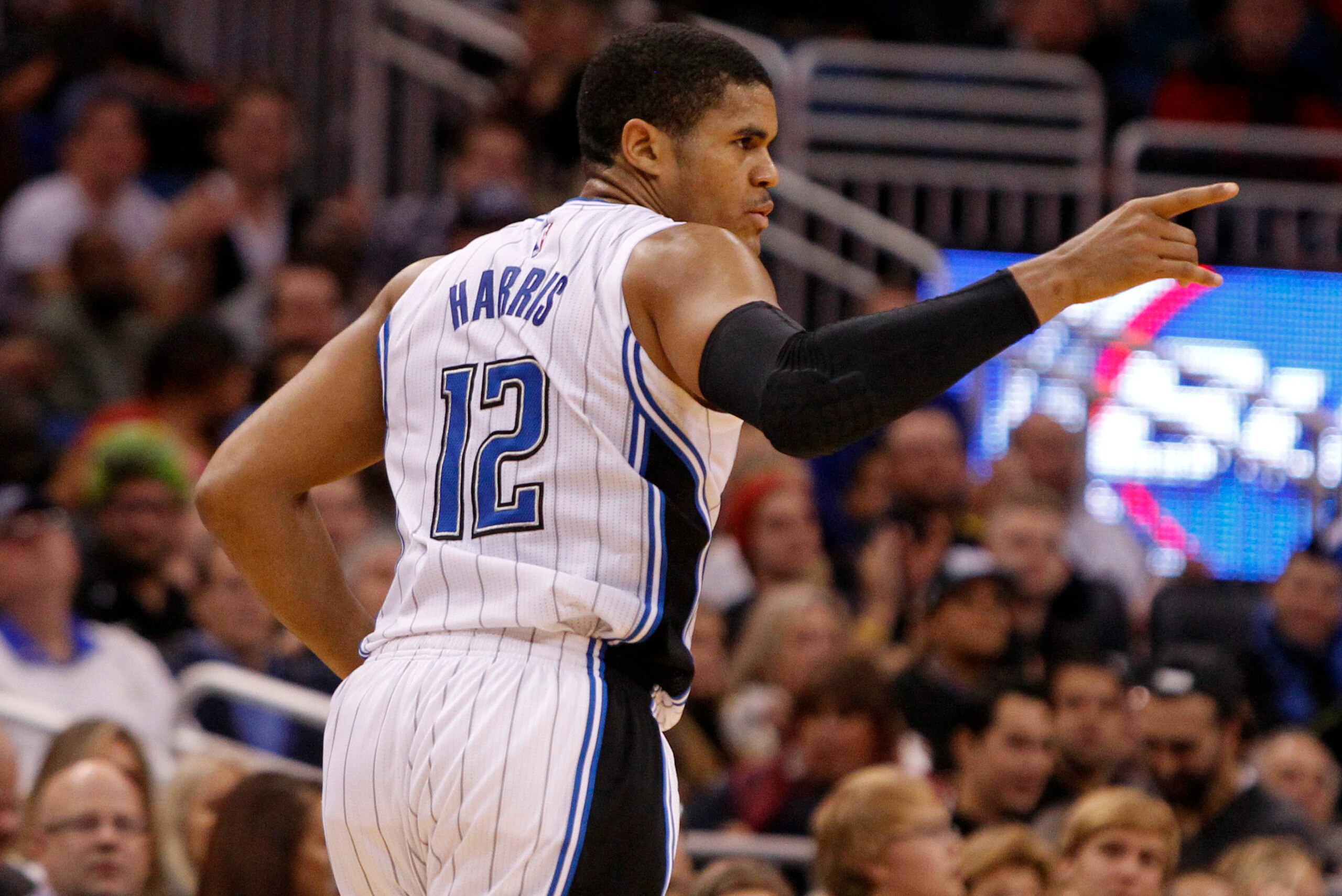 Nov 19, 2014; Orlando, FL, USA; Orlando Magic forward Tobias Harris (12) points after he made a three pointer against the Los Angeles Clippers during the second half at Amway Center. Los Angeles Clippers defeated the Orlando Magic 114-90. Mandatory Credit