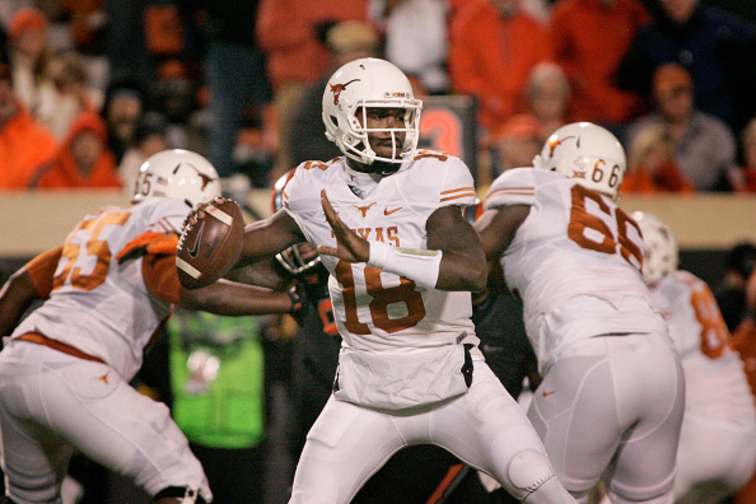 STILLWATER, OK - NOVEMBER 15:   Quarterback Tyrone Swoopes #18 of the Texas Longhorns looks to throw against the Oklahoma State Cowboys November 15, 2014 at Boone Pickens Stadium in Stillwater, Oklahoma. The Longhorns defeated the Cowboys 28-7.  (Photo by