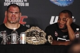Oct 19, 2013; Houston, TX, USA; Cain Velasquez (left) and Daniel Cormier during the press conference following UFC 166 at Toyota Center. Mandatory Credit: Andrew Richardson-USA TODAY Sports