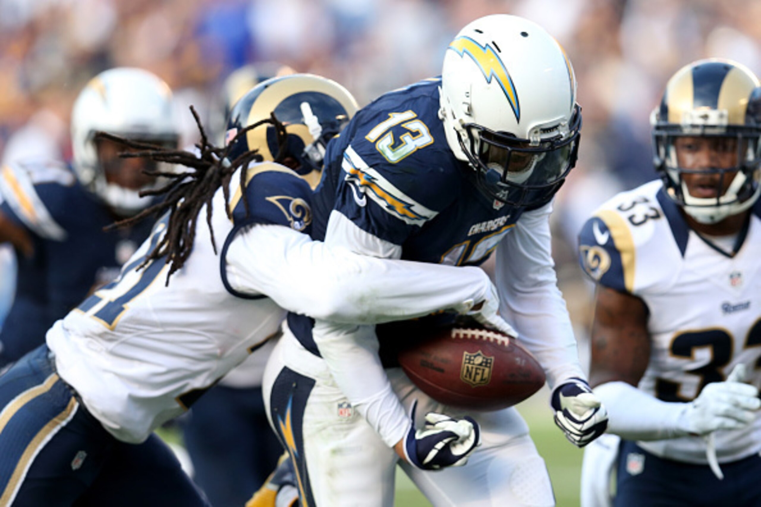 SAN DIEGO, CA - NOVEMBER 23:  Wide receiver Keenan Allen #13 of the San Diego Chargers is striped of the ball by defensive back Janoris Jenkins #21 of the St. Louis Rams to force a turnover i the third quarter at Qualcomm Stadium on November 23, 2014 in S