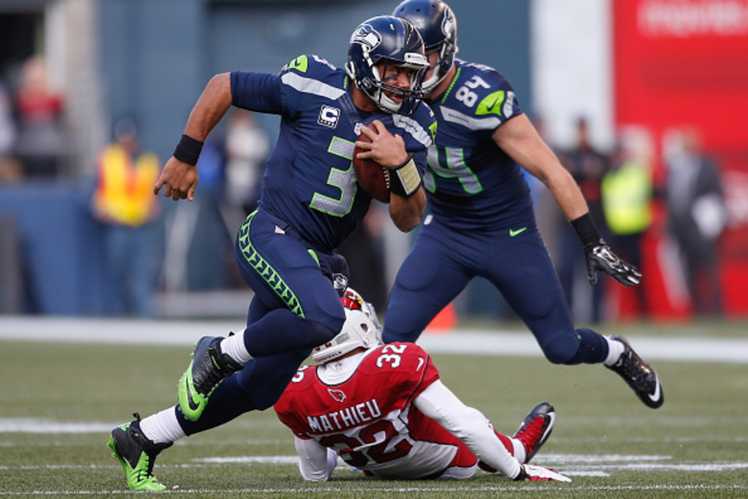 SEATTLE, WA - NOVEMBER 23:  Quarterback Russell Wilson #3 of the Seattle Seahawks rushes against the Arizona Cardinals at CenturyLink Field on November 23, 2014 in Seattle, Washington. The Seahawks defeated the Cardinals 19-3.  (Photo by Otto Greule Jr/Ge