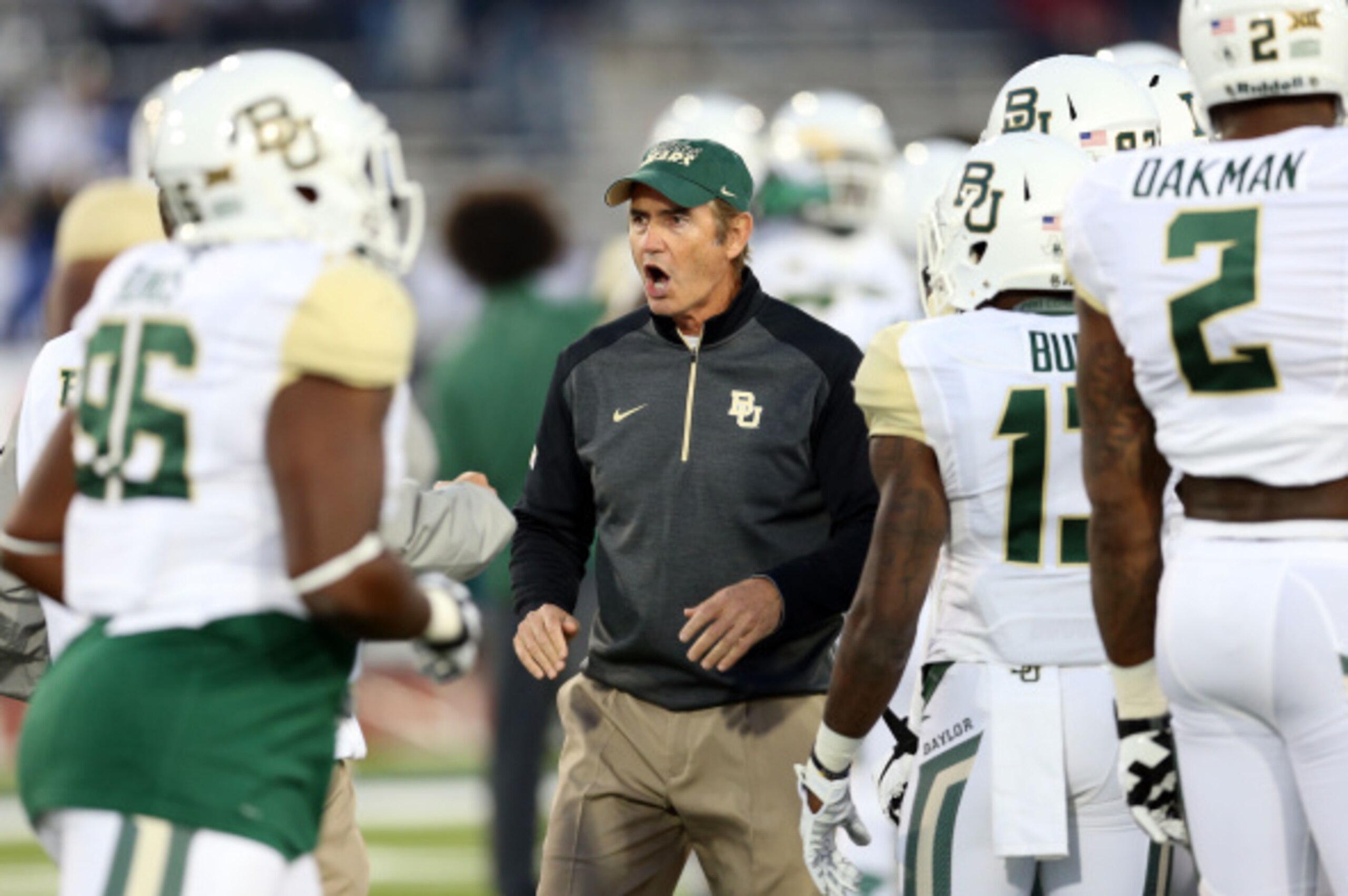 BUFFALO, NY - SEPTEMBER 12:  Head Coach Art Briles of the Baylor Bears chats to players prior to kickoff against the Buffalo Bulls at UB Stadium on September 12, 2014 in Buffalo, New York.  (Photo by Vaughn Ridley/Getty Images)