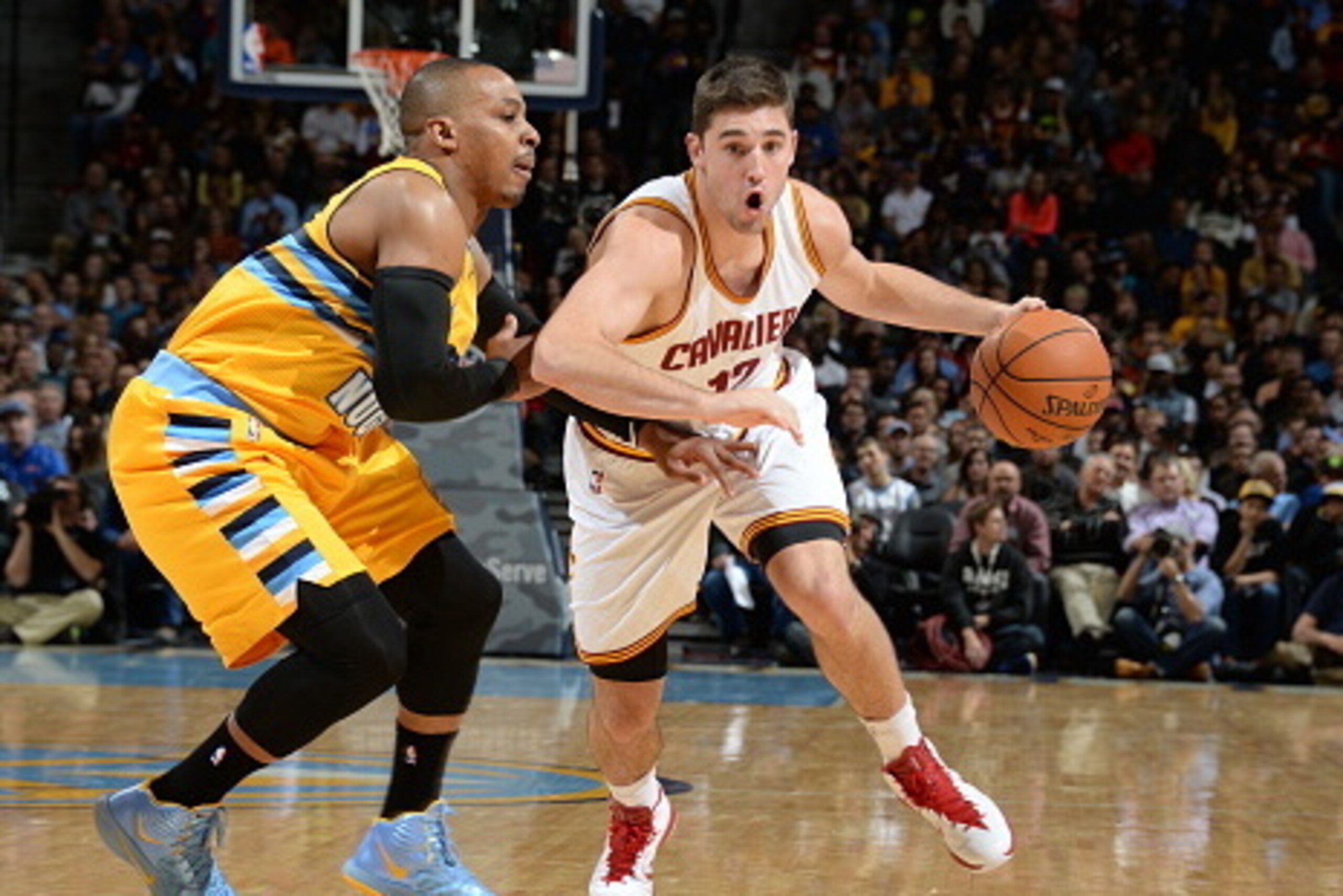 DENVER, CO - NOVEMBER 7:  Joe Harris #12 of the Cleveland Cavaliers drives to the basket against the Denver Nuggets on November 7, 2014 at the Pepsi Center in Denver, Colorado. NOTE TO USER: User expressly acknowledges and agrees that, by downloading and 