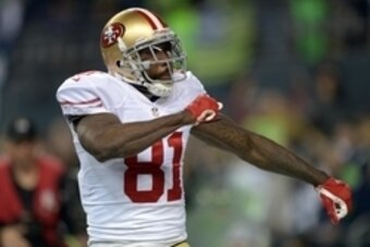Jan 19, 2014; Seattle, WA, USA; San Francisco 49ers wide receiver Anquan Boldin (81) celebrates after catching a touchdown pass against the Seattle Seahawks in the third quarter of the 2013 NFC Championship football game at CenturyLink Field. Mandatory Cr