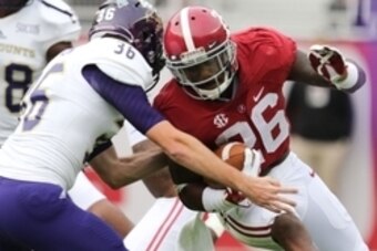 Nov 22, 2014; Tuscaloosa, AL, USA; Alabama Crimson Tide defensive back Landon Collins (26) is hit by Western Carolina Catamounts place kicker Richard Sigmon (36) at Bryant-Denny Stadium. Mandatory Credit: Marvin Gentry-USA TODAY Sports