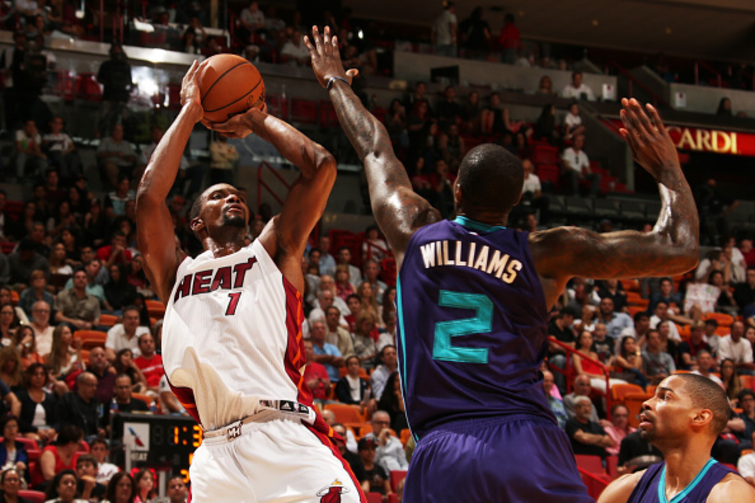 MIAMI, FL - November 23: Chris Bosh #1 of the Miami Heat takes a shot against the Charlotte Hornets at the American Airlines Arena in Miami, Florida on November 23, 2014. NOTE TO USER: User expressly acknowledges and agrees that, by downloading and/or usi