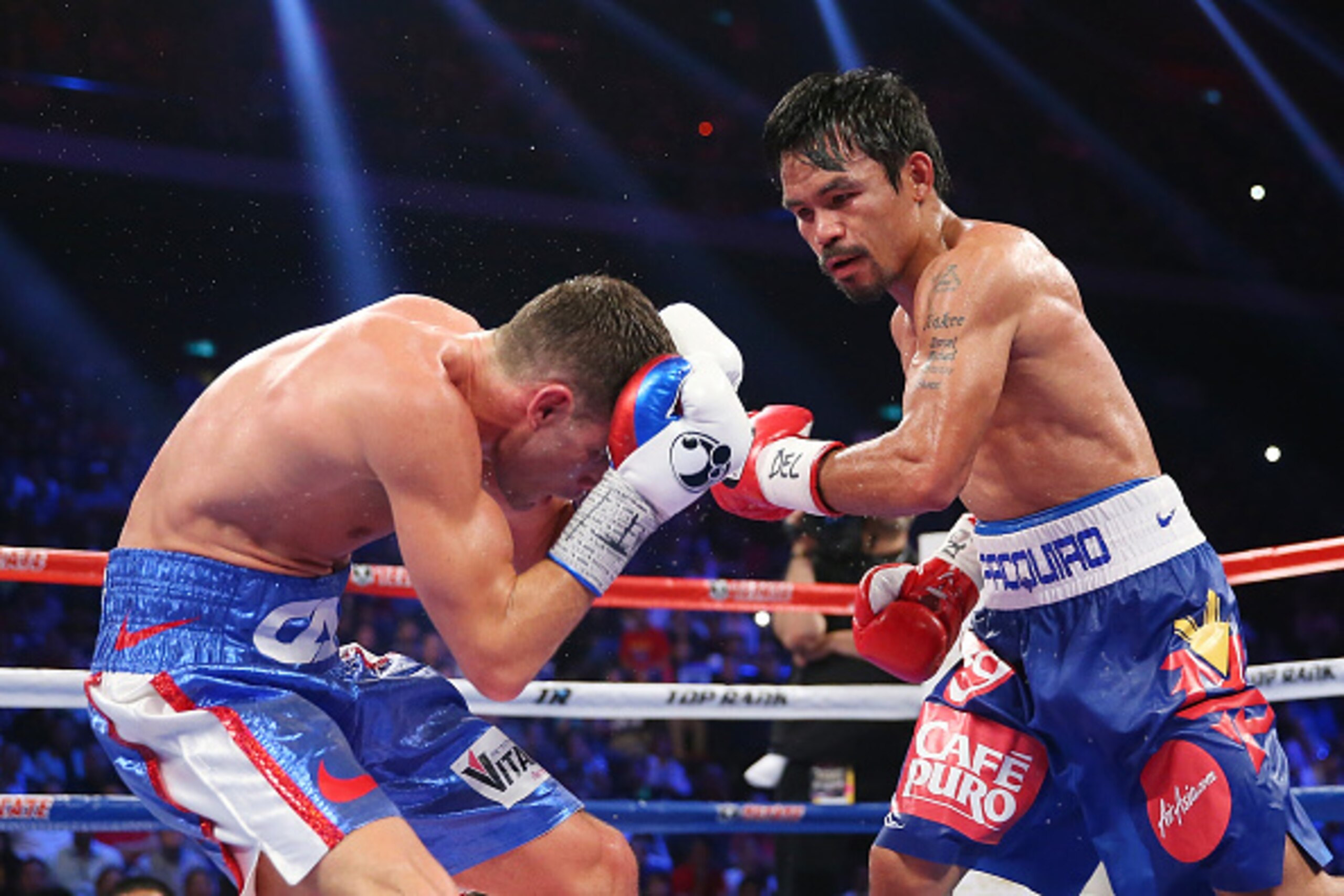 MACAU - NOVEMBER 23:  Manny Pacquiao of the Philippines punches Chris Algieri of the United States during the WBO world welterweight title at The Venetian on November 23, 2014 in Macau, Macau.  (Photo by Chris Hyde/Getty Images)