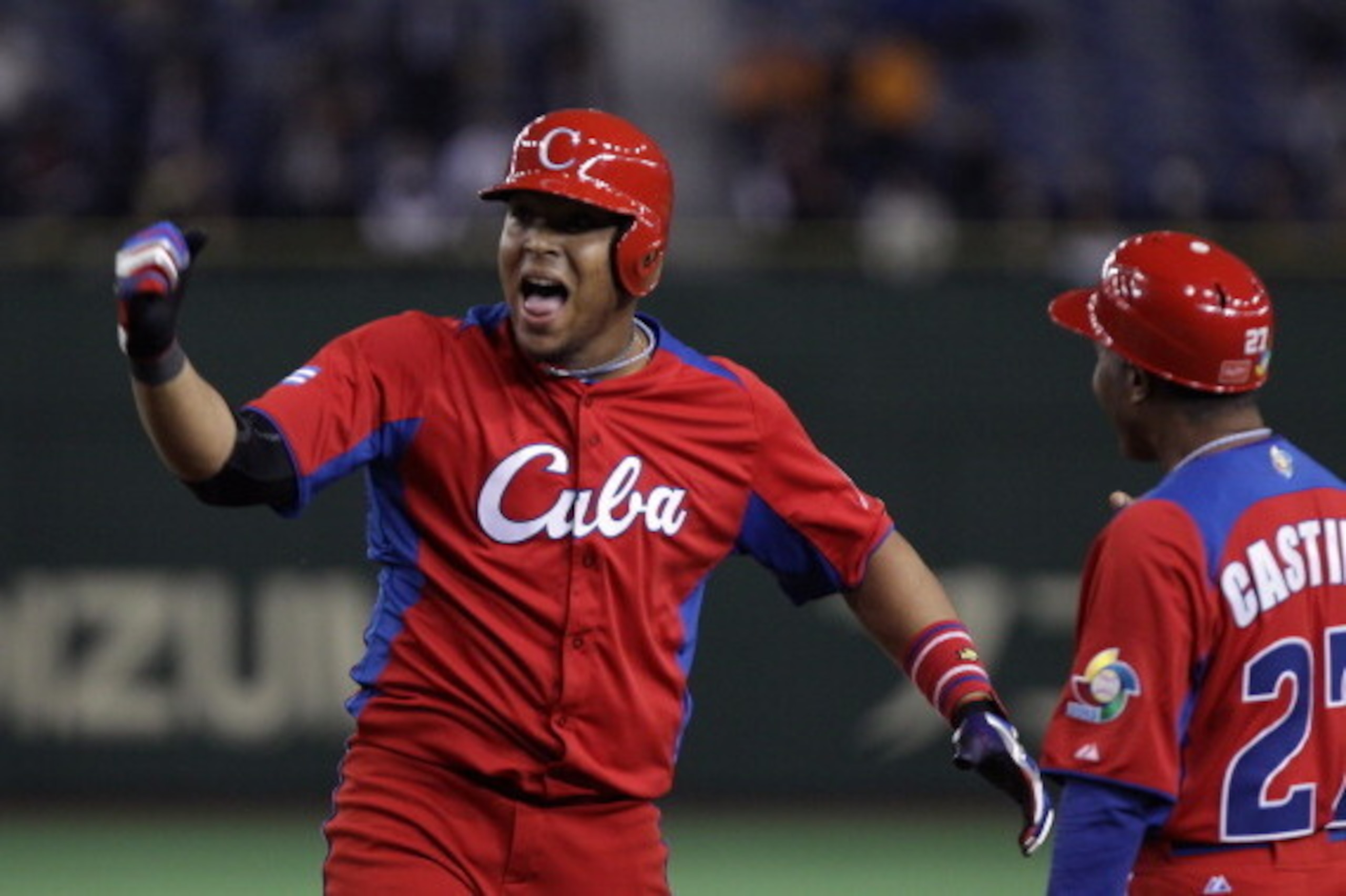 TOKYO, JAPAN - MARCH 11:  Outfielder Yasmany Tomas # 27 of Cuba reacts after hitting a RBI single in the eighth inning during the World Baseball Classic Second Round Pool 1 game between Cuba and the Netherlands at Tokyo Dome on March 11, 2013 in Tokyo, Ja