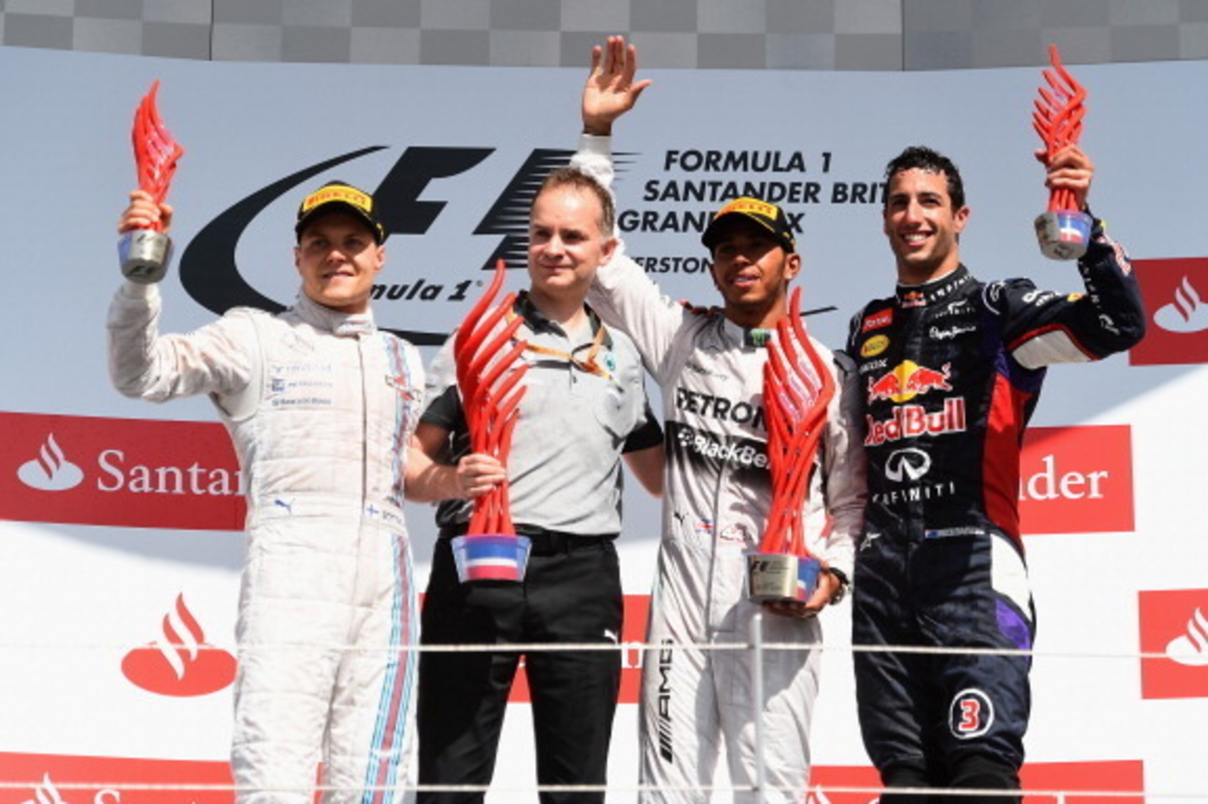 NORTHAMPTON, ENGLAND - JULY 06:  Lewis Hamilton of Great Britain and Mercedes GP celebrates on the podium next to Valtteri Bottas of Finland and Williams and Daniel Ricciardo of Australia and Infiniti Red Bull Racing after winning the British Formula One 