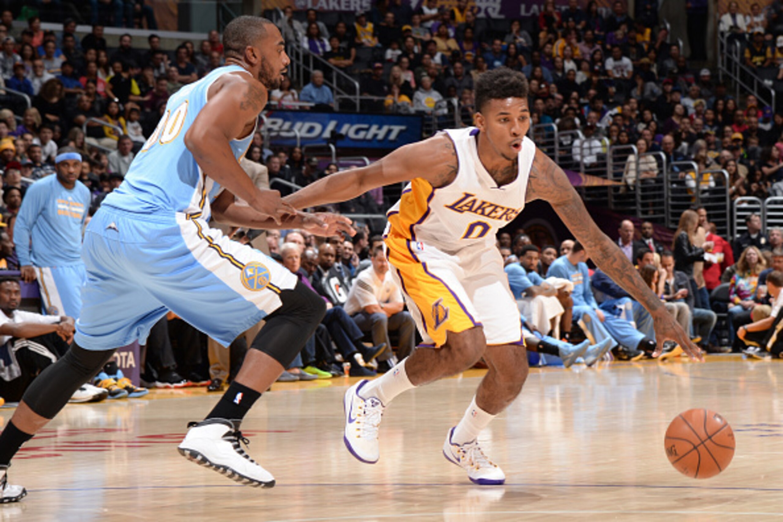 LOS ANGELES, CA - NOVEMBER 23: Nick Young #0 of the Los Angeles Lakers handles the ball against the Denver Nuggets at STAPLES Center on November 23, 2014 in Los Angeles, California. NOTE TO USER: User expressly acknowledges and agrees that, by downloading