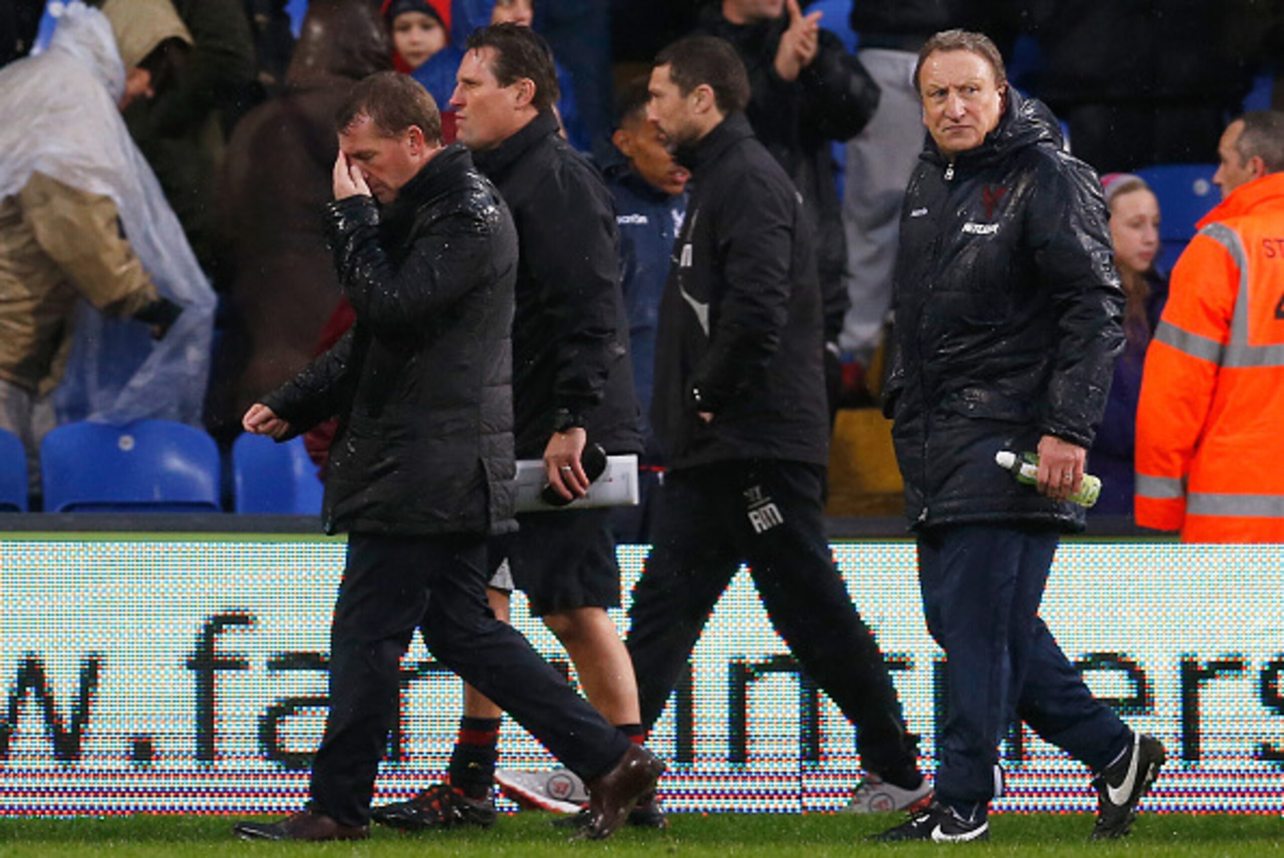 LONDON, ENGLAND - NOVEMBER 23:  Brendan Rodgers, manager of Liverpool walks to the dressing room with Neil Warnock, manager of Crystal Palace after the Barclays Premier League match between Crystal Palace and Liverpool at Selhurst Park on November 23, 201