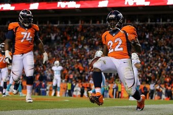 DENVER, CO - NOVEMBER 23:  Running back C.J. Anderson #22 of the Denver Broncos celebrates a fourth quarter touchdown against the Miami Dolphins at Sports Authority Field at Mile High on November 23, 2014 in Denver, Colorado.  (Photo by Justin Edmonds/Get