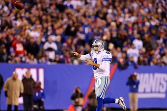 EAST RUTHERFORD, NJ - NOVEMBER 23:   Tony Romo #9 of the Dallas Cowboys throws a touchdown pass to  Dez Bryant #88 in the third quarter against the New York Giants at MetLife Stadium on November 23, 2014 in East Rutherford, New Jersey.  (Photo by Elsa/Get