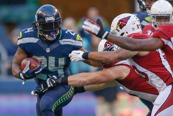 SEATTLE, WA - NOVEMBER 23:  Running back Marshawn Lynch #24 of the Seattle Seahawks rushes against the Arizona Cardinals at CenturyLink Field on November 23, 2014 in Seattle, Washington. The Seahawks defeated the Cardinals 19-3.  (Photo by Otto Greule Jr/