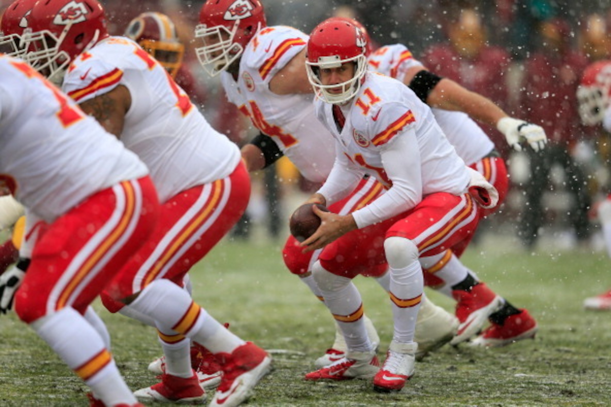 LANDOVER, MD - DECEMBER 08: Quarterback Alex Smith #11 of the Kansas City Chiefs drops back to hand the ball off during the first quarter against the Washington Redskins at FedExField on December 8, 2013 in Landover, Maryland.  (Photo by Rob Carr/Getty Im