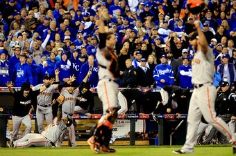 KANSAS CITY, MO - OCTOBER 29:  Buster Posey #28 , Madison Bumgarner #40, Pablo Sandoval #48 and the San Francisco Giants celebrate after defeating the Kansas City Royals to win Game Seven of the 2014 World Series by a score of 3-2 at Kauffman Stadium on O