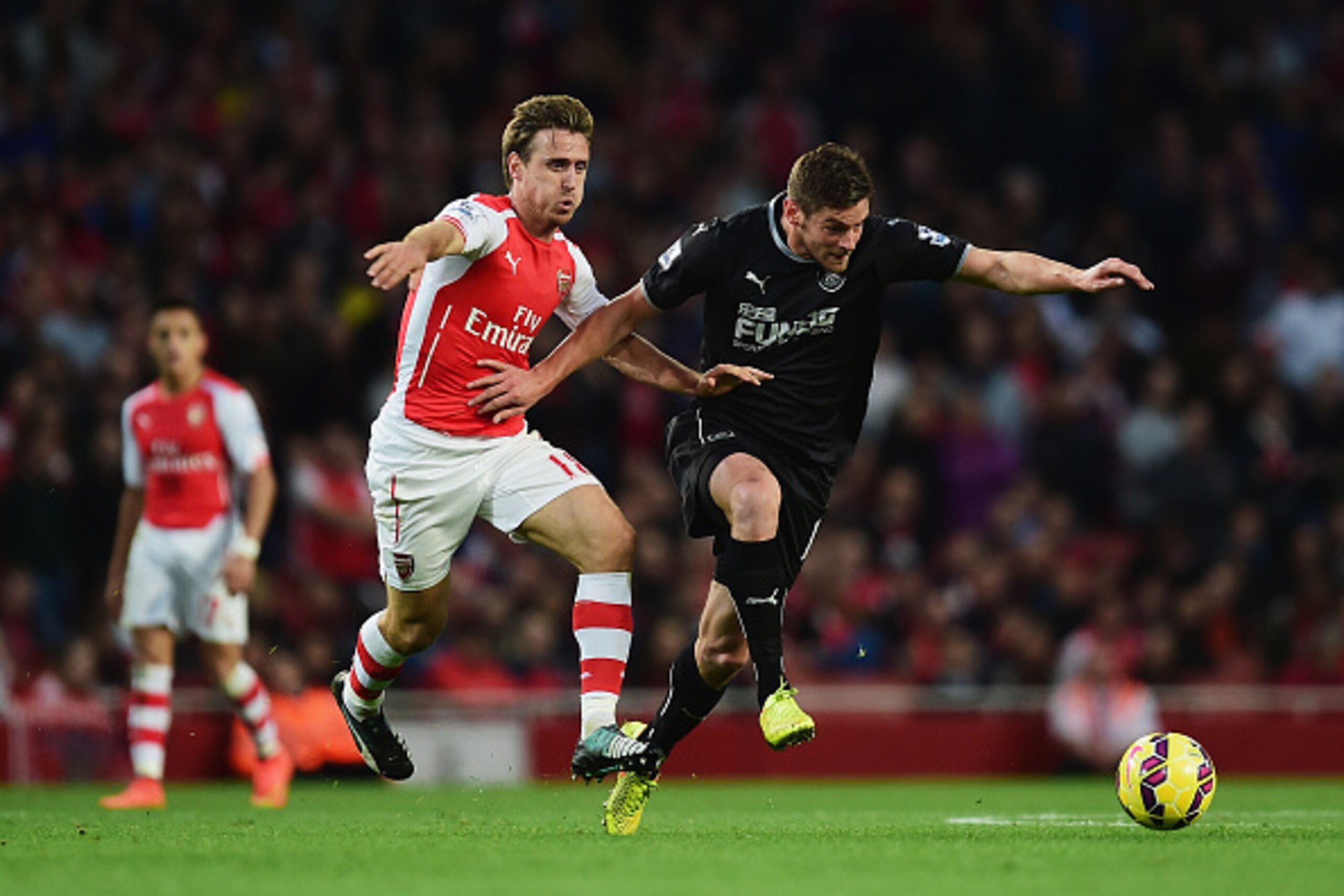 LONDON, ENGLAND - NOVEMBER 01: Nacho Monreal of Arsenal and Thomas Heaton (R) of Burnley in action  during the Barclays Premier League match between Arsenal and Burnley at Emirates Stadium on November 1, 2014 in London, England.  (Photo by Jamie McDonald/