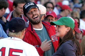 BOSTON - OCTOBER 01:  Actor Ben Affleck and wife, actress Jennifer Garner laugh with player Kevin Millar #15 of the Boston Red Sox prior to the start of the game against the New York Yankees at Fenway Park on October 1, 2005 in Boston, Massachusetts.  (Ph