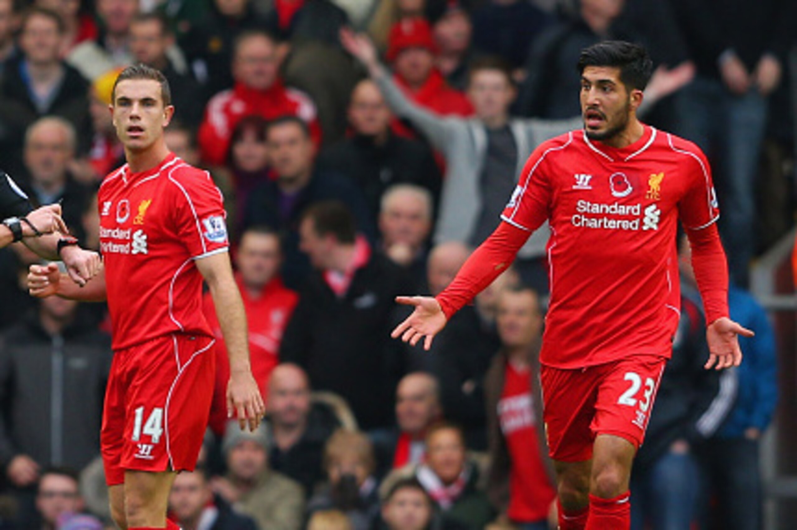 LIVERPOOL, ENGLAND - NOVEMBER 08: Referee Anthony Taylor points at his watch to signal a goal to Chelsea using goal line technology as Jordan Henderson and Emre Can of Liverpool look on during the Barclays Premier League match between Liverpool and Chelse