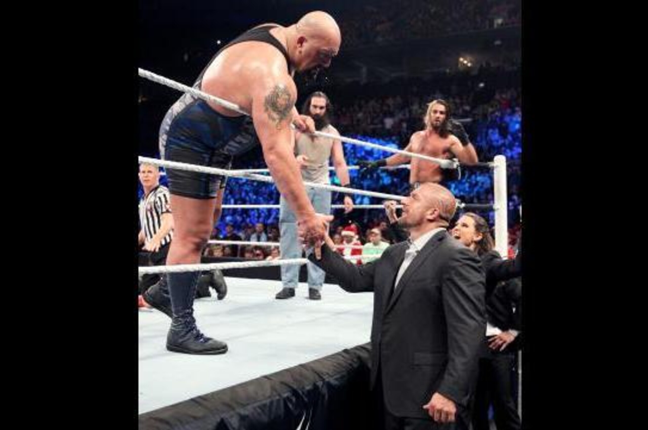Big Show shakes Triple H's hand mid-match.