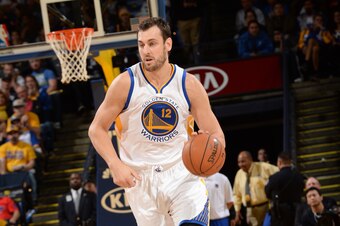 OAKLAND, CA - NOVEMBER 21:  Andrew Bogut #12 of the Golden State Warriors brings the ball up court against the Utah Jazz on November 21, 2014 at ORACLE Arena in Oakland, California. NOTE TO USER: User expressly acknowledges and agrees that, by downloading