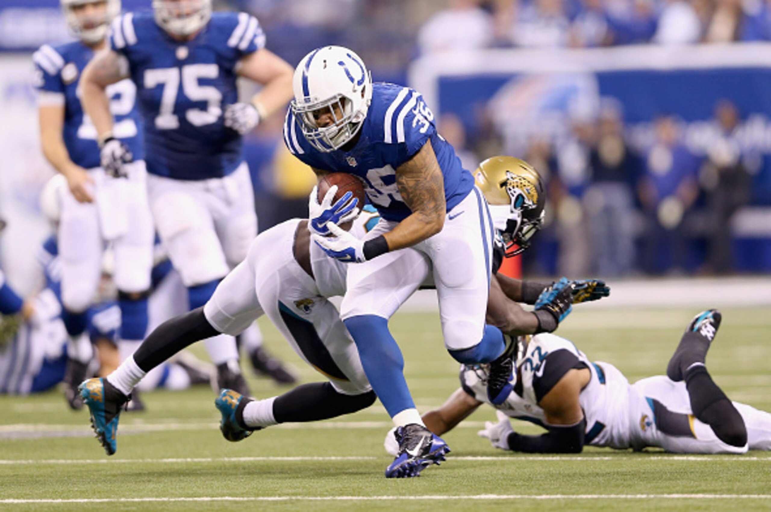 INDIANAPOLIS, IN - NOVEMBER 23:  Daniel Herron #36 of the Indianapolis Colts runs with the ball during the game against the Jacksonville Jaguars at Lucas Oil Stadium on November 23, 2014 in Indianapolis, Indiana.  (Photo by Andy Lyons/Getty Images)