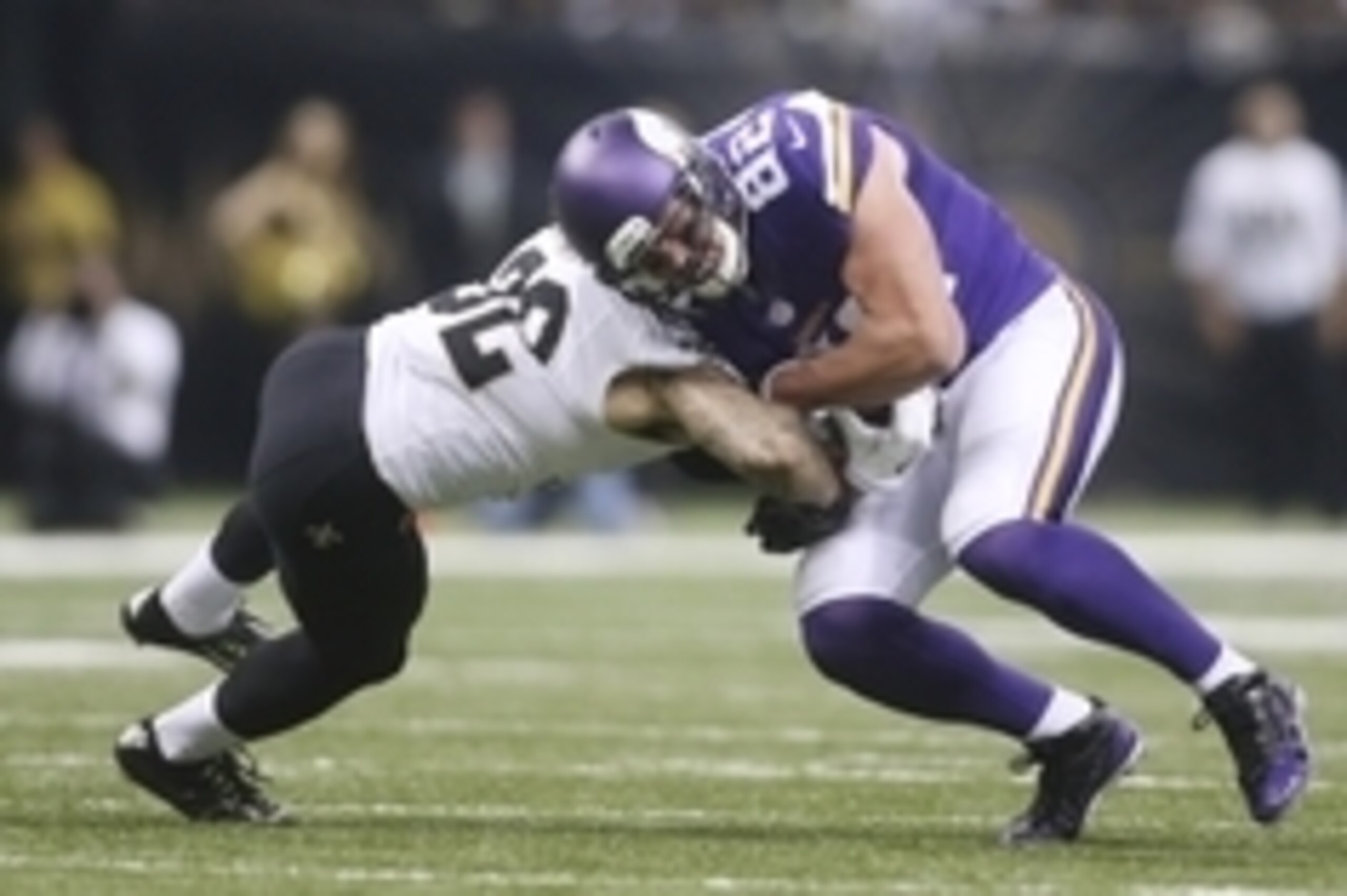 Sep 21, 2014; New Orleans, LA, USA; New Orleans Saints strong safety Kenny Vaccaro (32) tackles Minnesota Vikings tight end Kyle Rudolph (82) in the second half at the Mercedes-Benz Superdome. New Orleans defeated the Vikings 20-9. Mandatory Credit: Cryst