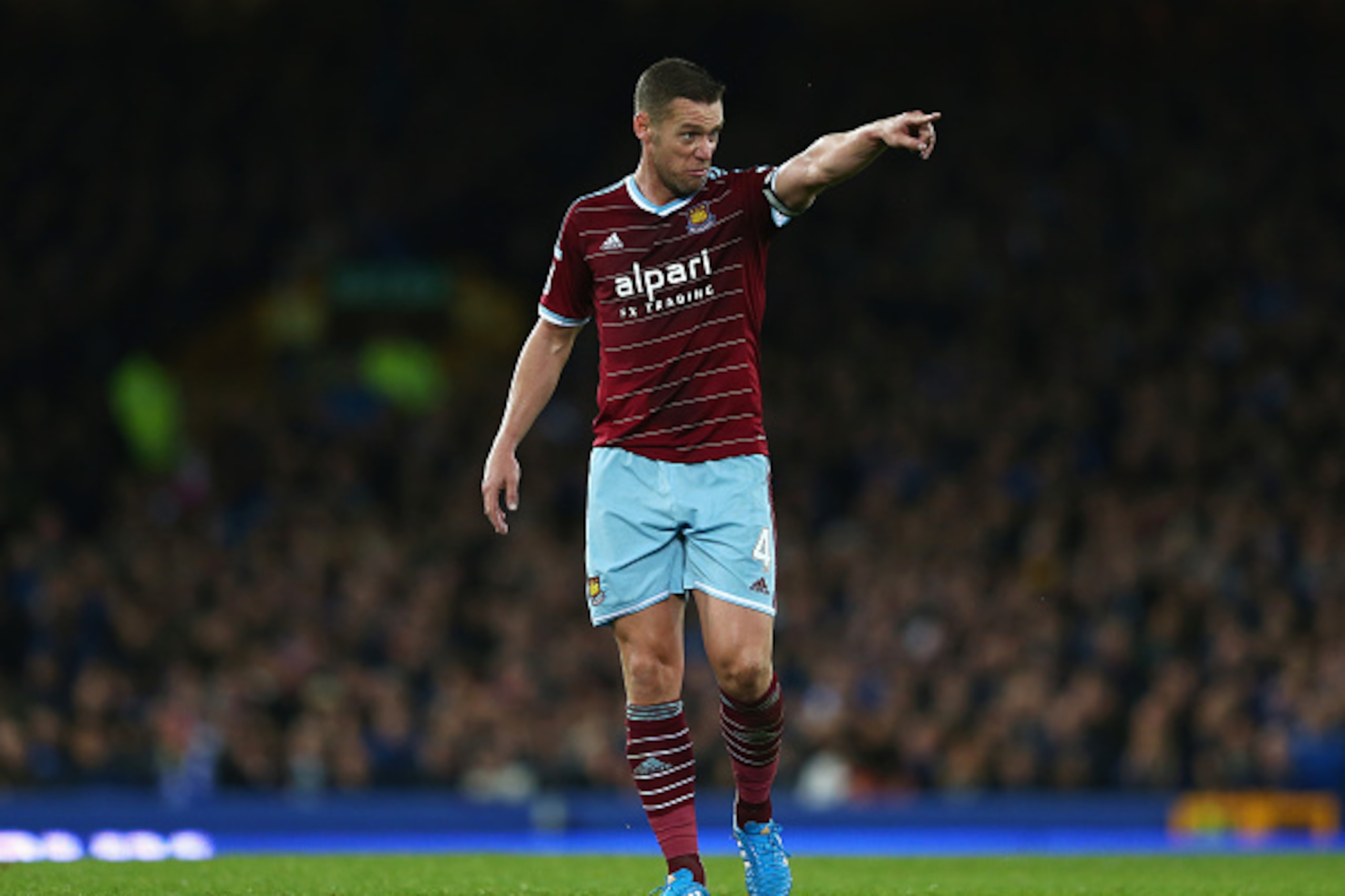 LIVERPOOL, ENGLAND - NOVEMBER 22:  Kevin Nolan of West Ham United makes his point during the Barclays Premier League match between Everton and West Ham United at Goodison Park on November 22, 2014 in Liverpool, England.  (Photo by Matthew Lewis/Getty Imag