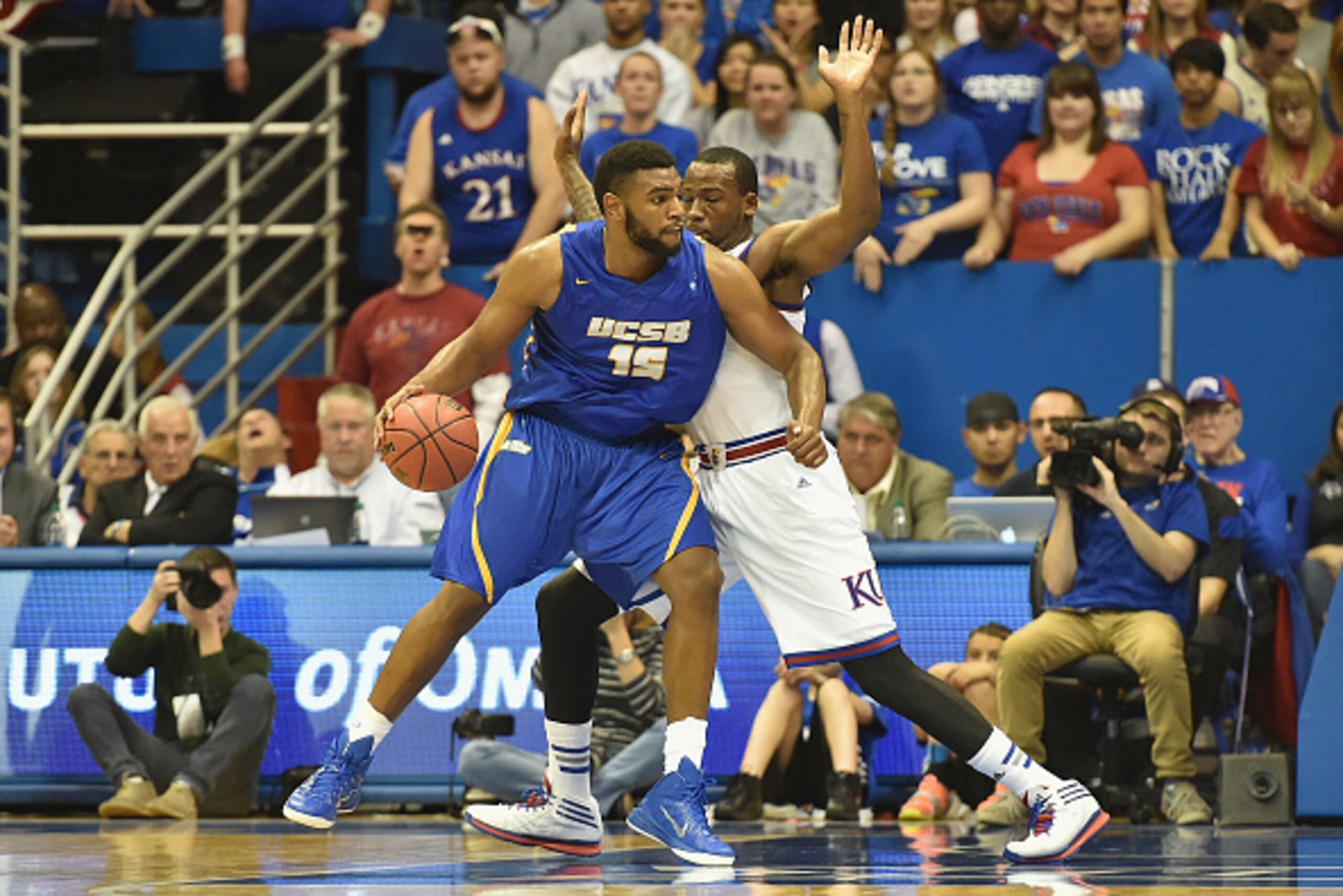 LAWRENCE, KS - NOVEMBER 14:  Alan Williams #15 of the UC Santa Barbara Gauchos posts up Cliff Alexander #2 of the Kansas Jayhawks in the second half at Allen Fieldhouse on November 14, 2014 in Lawrence, Kansas. (Photo by Michael B. Thomas/Getty Images)