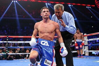 MACAU - NOVEMBER 23:  Manny Pacquiao of the Philippines knockes down Chris Algieri of the United States during the world welterweight title at The Venetian on November 23, 2014 in Macau, Macau.  (Photo by Chris Hyde/Getty Images)