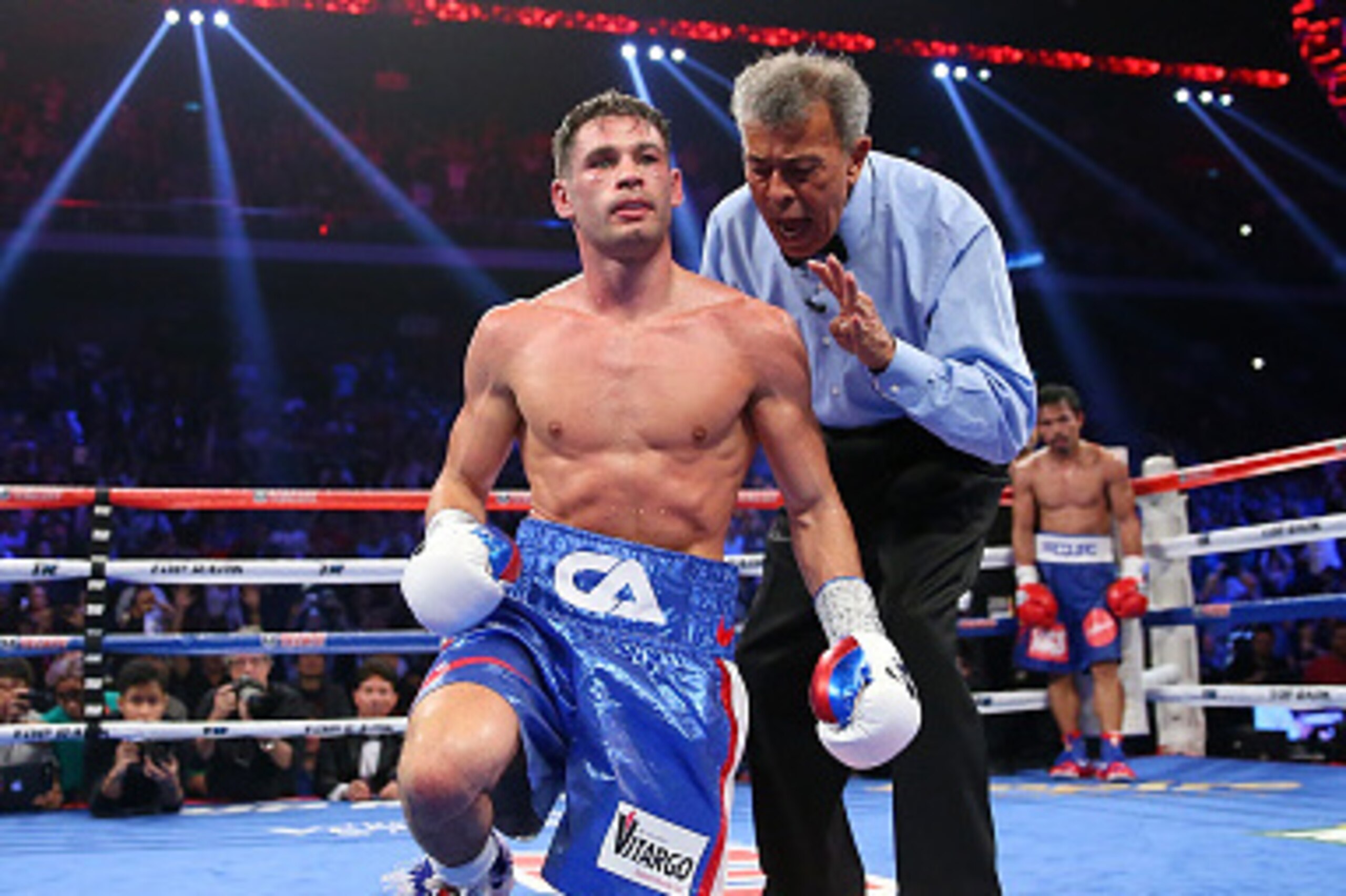 MACAU - NOVEMBER 23:  Manny Pacquiao of the Philippines knockes down Chris Algieri of the United States during the world welterweight title at The Venetian on November 23, 2014 in Macau, Macau.  (Photo by Chris Hyde/Getty Images)