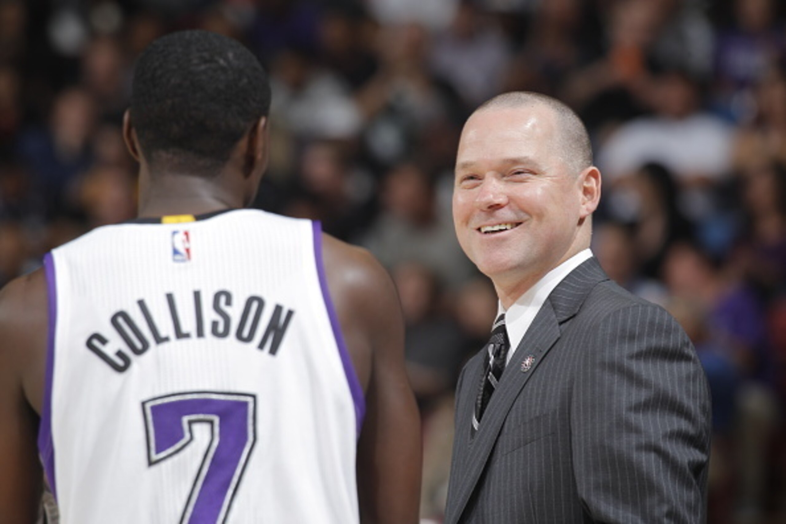 SACRAMENTO, CA - NOVEMBER 5:  Head Coach Michael Malone of the Sacramento Kings talks with point guard Darren Collison #7 during a break in action against the Denver Nuggets at Sleep Train Arena on November 5, 2014 in Sacramento, California. NOTE TO USER: