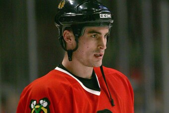 CHICAGO - MARCH 19: Brandon Bochenski #20 of the Chicago Blackhawks looks on during the game against the Phoenix Coyotes on March 19, 2006 at the United Center in Chicago, Illinois. (Photo by Jonathan Daniel/Getty Images)