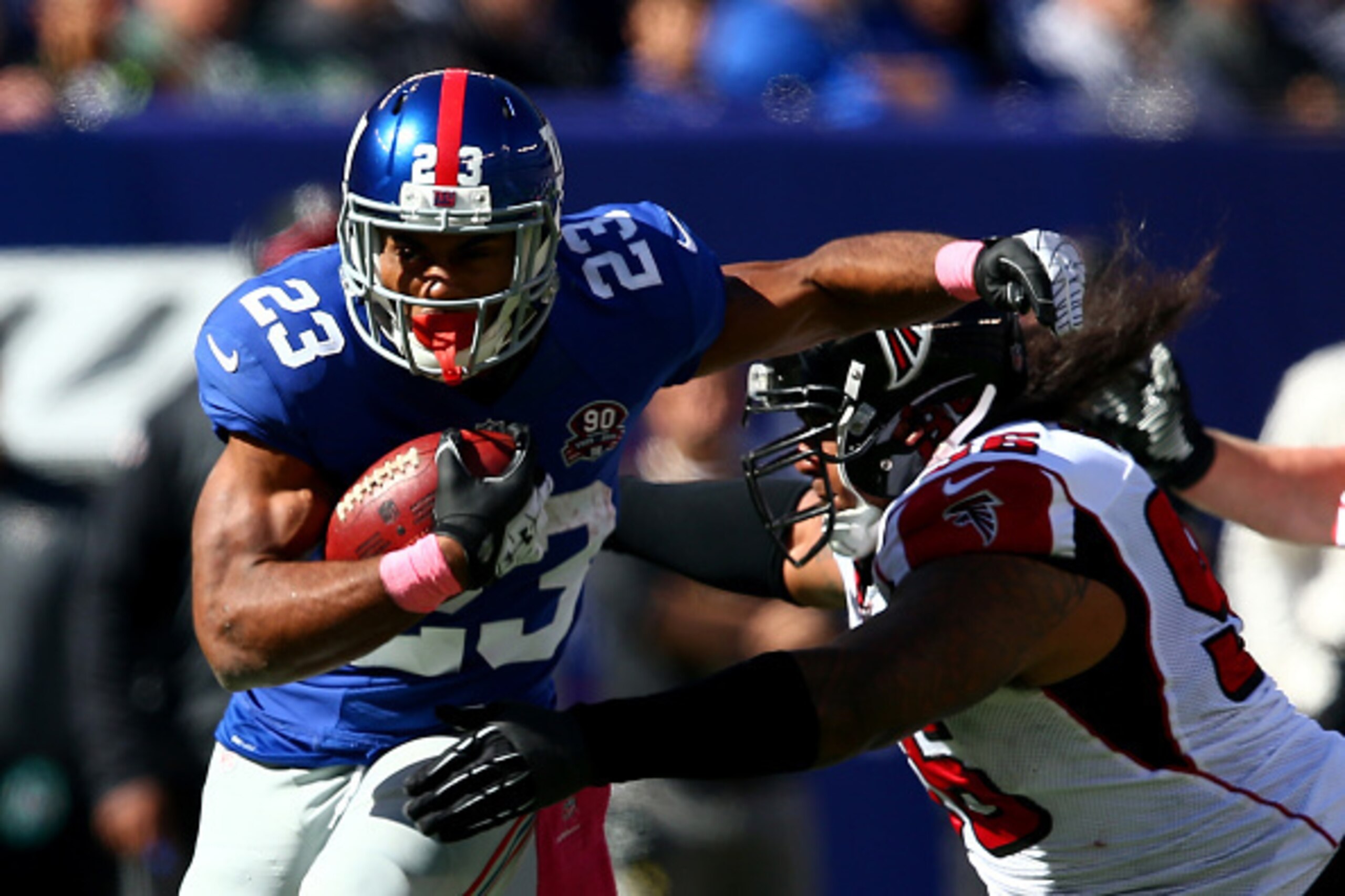 EAST RUTHERFORD, NJ - OCTOBER 05:  Running back Rashad Jennings #23 of the New York Giants runs the ball against the Atlanta Falcons during their game at MetLife Stadium on October 5, 2014 in East Rutherford, New Jersey.  (Photo by Elsa/Getty Images)