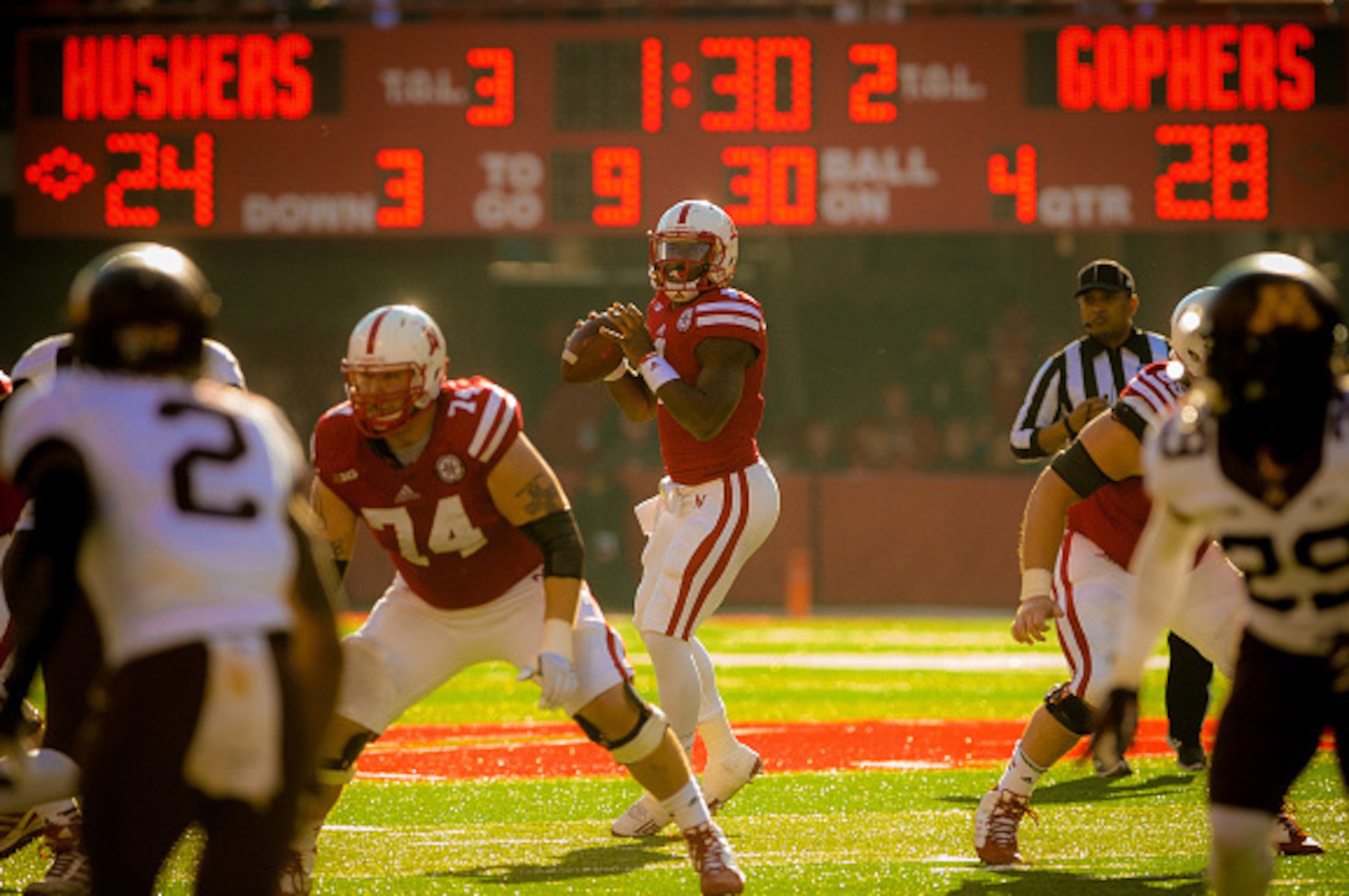 LINCOLN, NE - NOVEMBER 22: Quarterback Tommy Armstrong Jr. #4 of the Nebraska Cornhuskers leads a late game comeback attempt that came up short against the Minnesota Golden Gophers at Memorial Stadium on November 22, 2014 in Lincoln, Nebraska. Minnesota d LINCOLN, NE - NOVEMBER 22: Quarterback Tommy Armstrong Jr. #4 of the Nebraska Cornhuskers leads a late game comeback attempt that came up short against the Minnesota Golden Gophers at Memorial Stadium on November 22, 2014 in Lincoln, Nebraska. Minnesota d