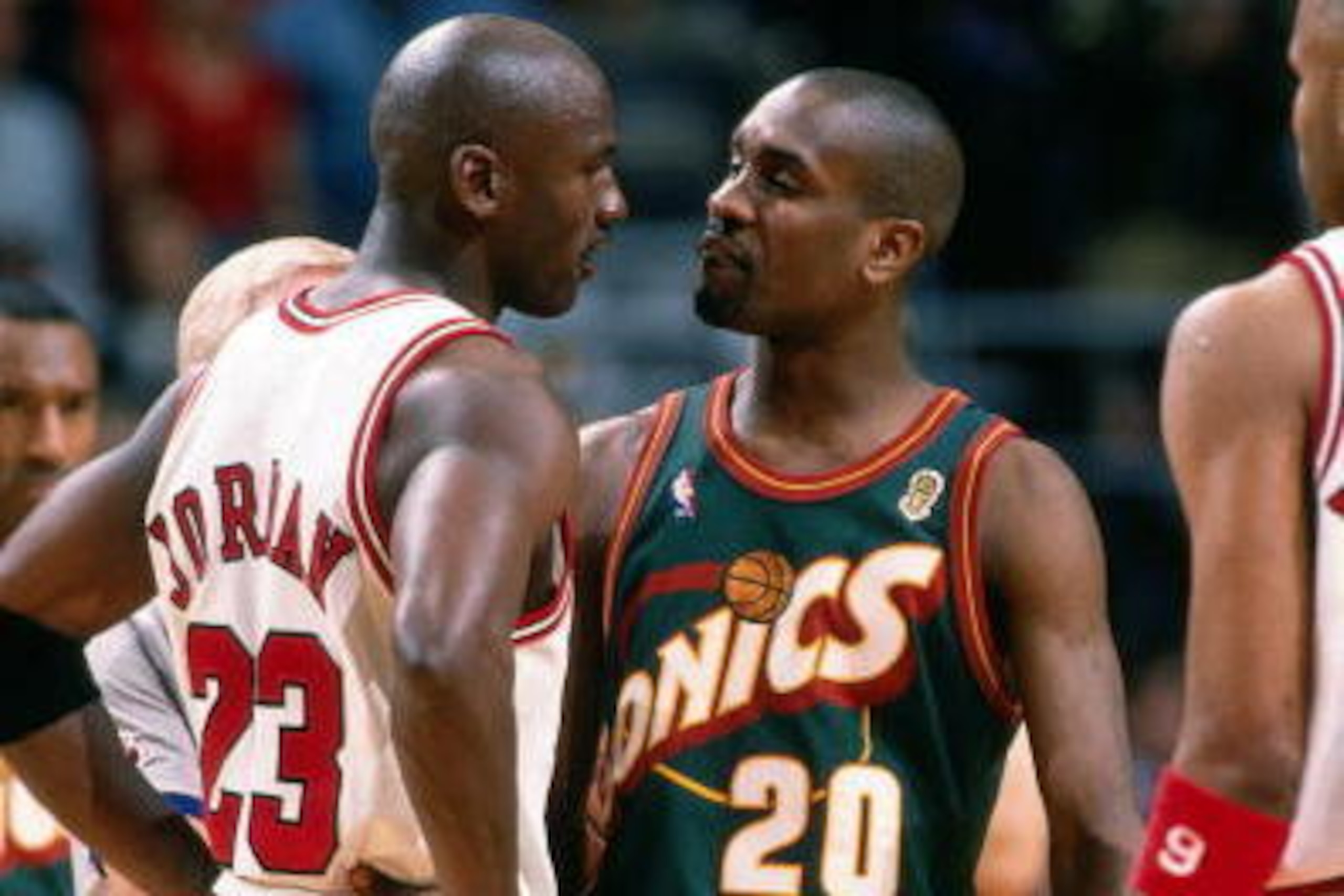 CHICAGO - JUNE 7:  Gary Payton #20 of the Seattle SuperSonics goes head to head with Michael Jordan #23 of the Chicago Bulls during Game Two of the NBA Finals at the United Center on June 7, 1996 in Chicago, Illinois.  NOTE TO USER: User expressly acknowl