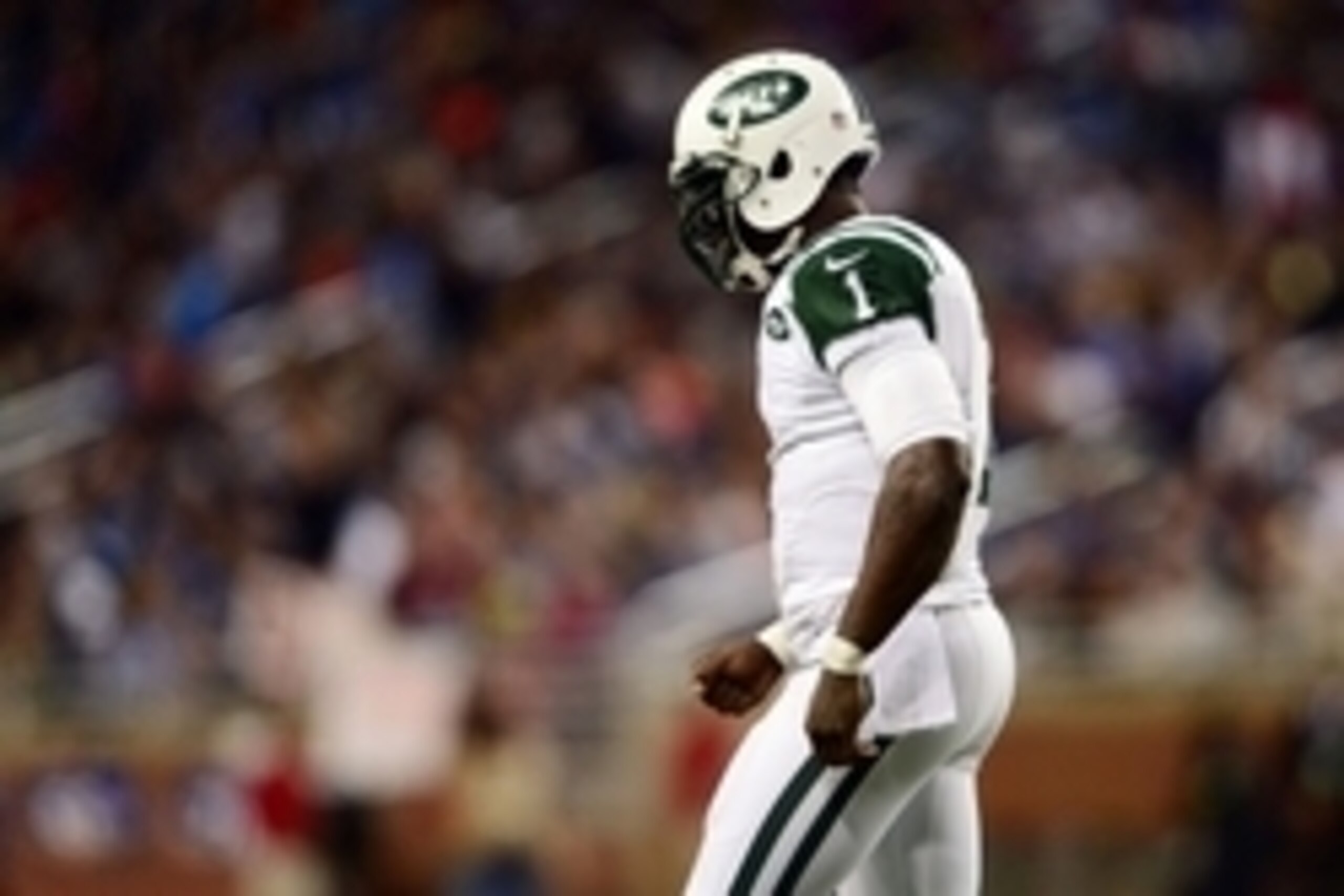 Nov 24, 2014; Detroit, MI, USA; New York Jets quarterback Michael Vick (1) walks to the sidelines after throwing an incomplete pass during the first quarter against the Buffalo Bills at Ford Field. Mandatory Credit: Andrew Weber-USA TODAY Sports