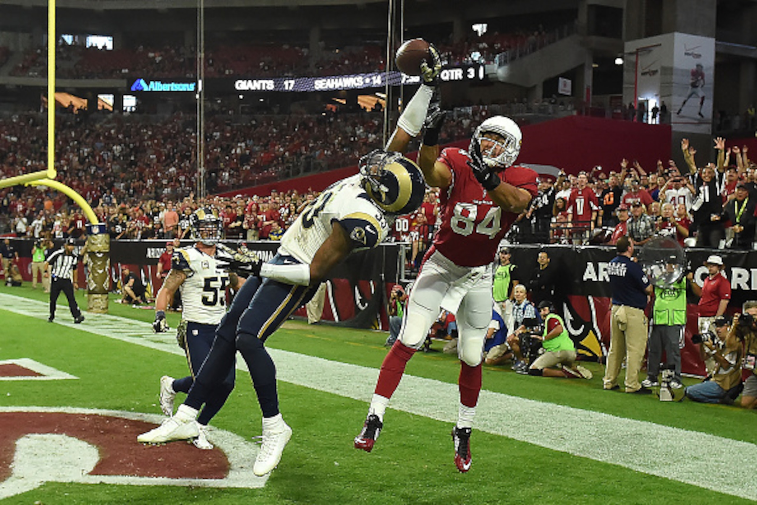 GLENDALE, AZ - NOVEMBER 09: Cornerback E.J. Gaines #33 of the St. Louis Rams knocks the football away from tight end Rob Housler #84 of the Arizona Cardinals in the third quarter of the NFL game at University of Phoenix Stadium on November 9, 2014 in Gle GLENDALE, AZ - NOVEMBER 09: Cornerback E.J. Gaines #33 of the St. Louis Rams knocks the football away from tight end Rob Housler #84 of the Arizona Cardinals in the third quarter of the NFL game at University of Phoenix Stadium on November 9, 2014 in Gle