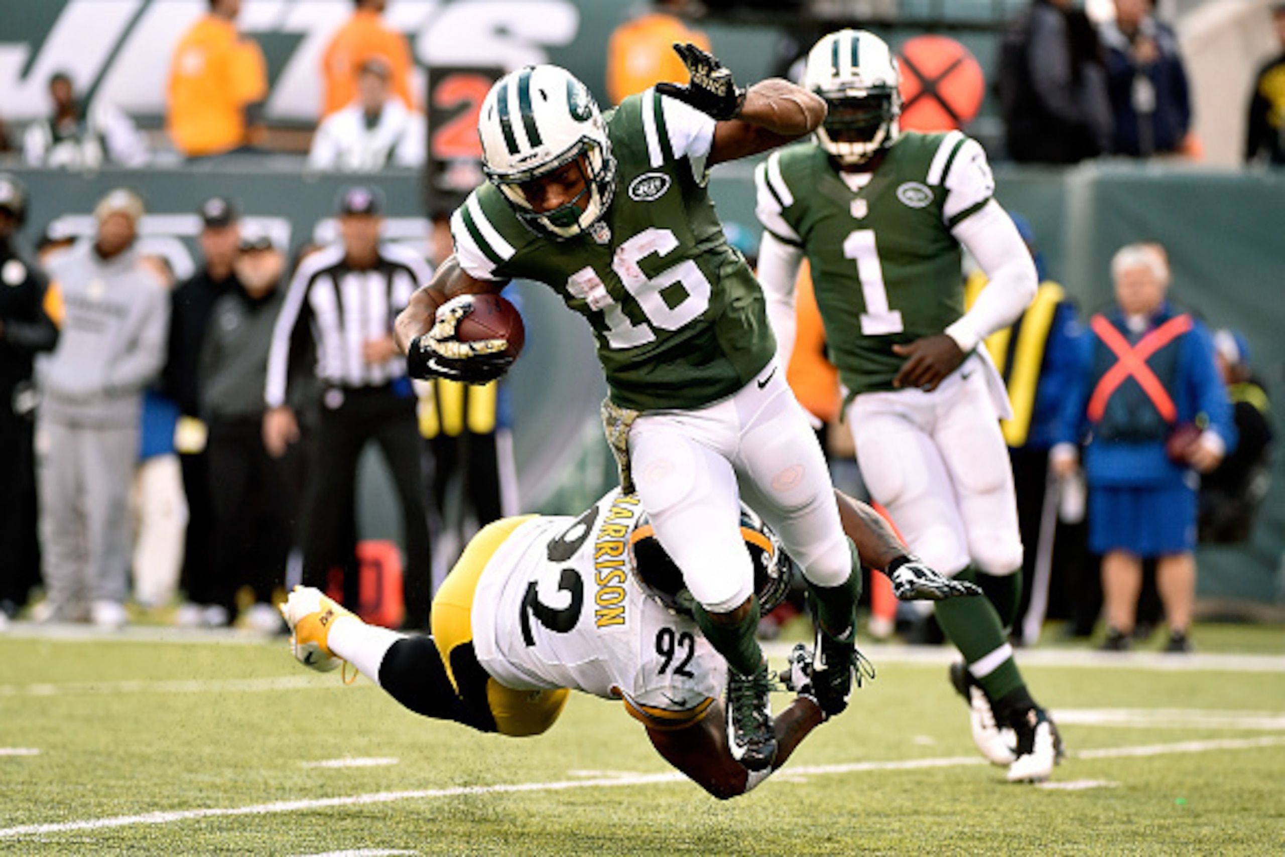 EAST RUTHERFORD, NJ - NOVEMBER 09: Wide receiver Percy Harvin #16 of the New York Jets is tackled by linebacker James Harrison #92 of the Pittsburgh Steelers during a game at MetLife Stadium on November 9, 2014 in East Rutherford, New Jersey.  (Photo by A