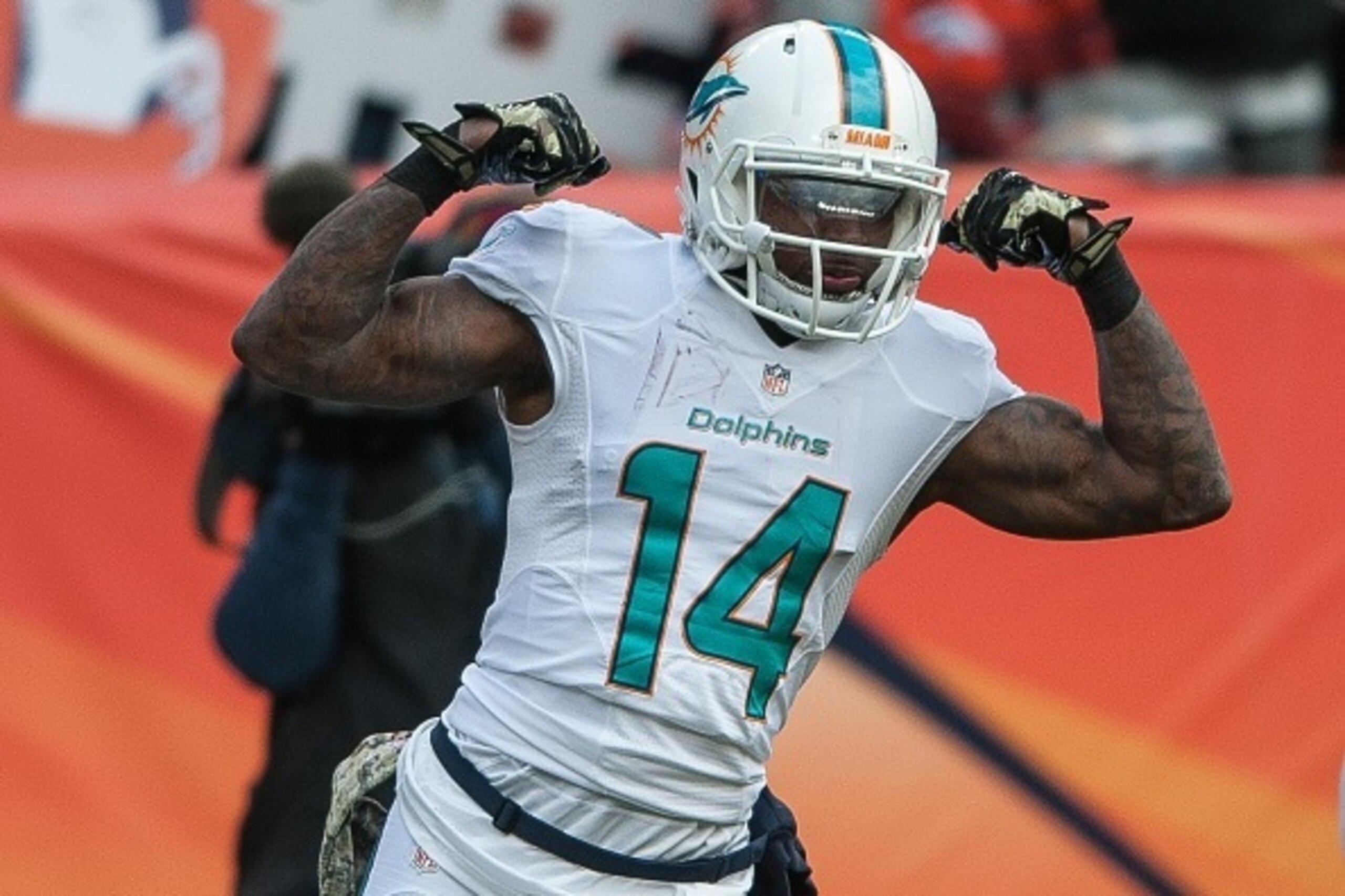 DENVER, CO - NOVEMBER 23: Wide receiver Jarvis Landry #14 of the Miami Dolphins celebrates a 20-yard reception in the first quarter of a game against the Denver Broncos at Sports Authority Field at Mile High on November 23, 2014 in Denver, Colorado. (Ph DENVER, CO - NOVEMBER 23: Wide receiver Jarvis Landry #14 of the Miami Dolphins celebrates a 20-yard reception in the first quarter of a game against the Denver Broncos at Sports Authority Field at Mile High on November 23, 2014 in Denver, Colorado. (Ph