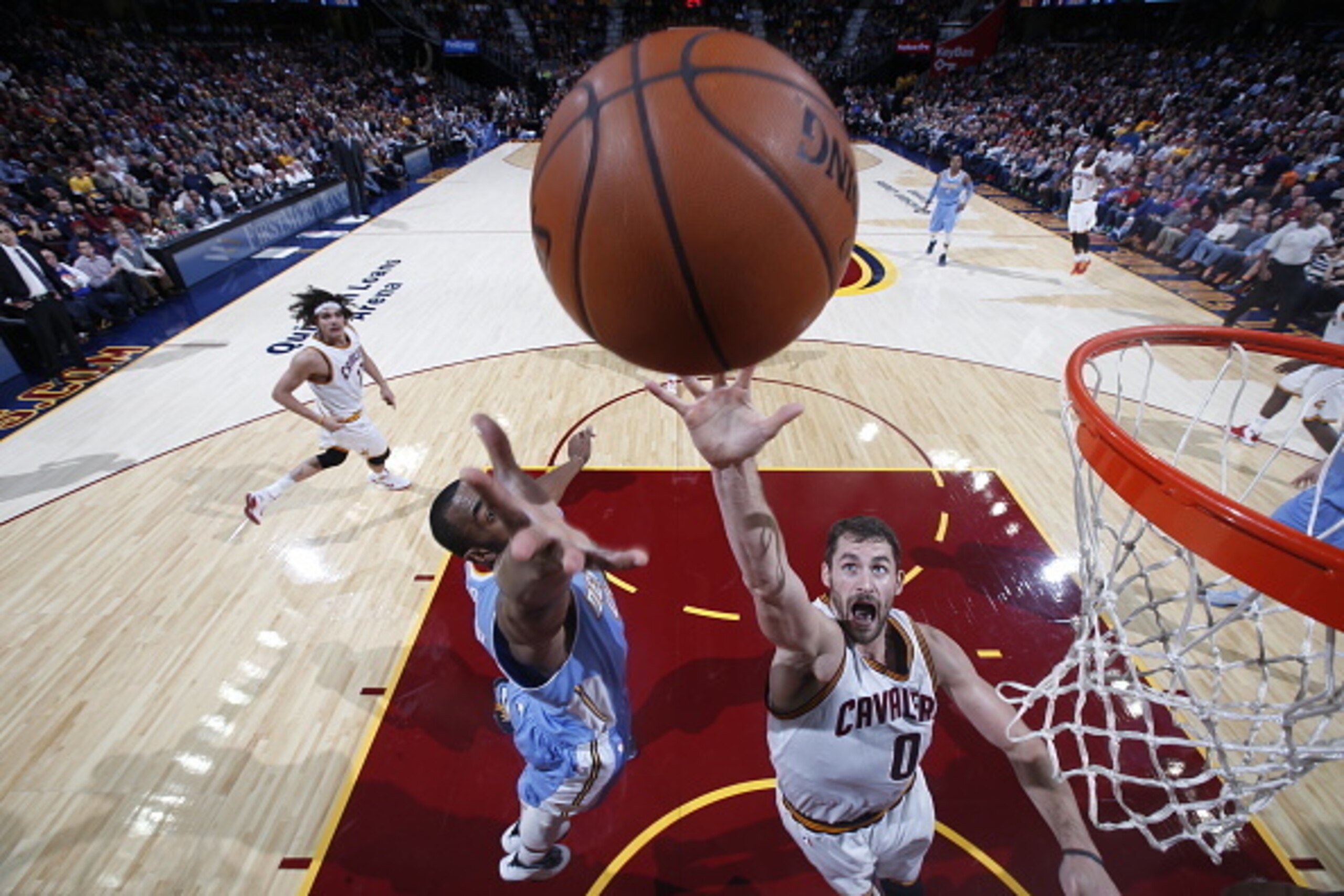 CLEVELAND, OH - NOVEMBER 17: Kevin Love #0 of the Cleveland Cavaliers goes up for a rebound against the Denver Nuggets during the game on November 17, 2014 at Quicken Loans Arena in Cleveland, Ohio. NOTE TO USER: User expressly acknowledges and agrees tha