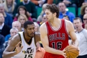 Nov 24, 2014; Salt Lake City, UT, USA; Utah Jazz forward Derrick Favors (15) defends against Chicago Bulls forward Pau Gasol (16) during the second half at EnergySolutions Arena. Chicago won 97-95. Mandatory Credit: Russ Isabella-USA TODAY Sports